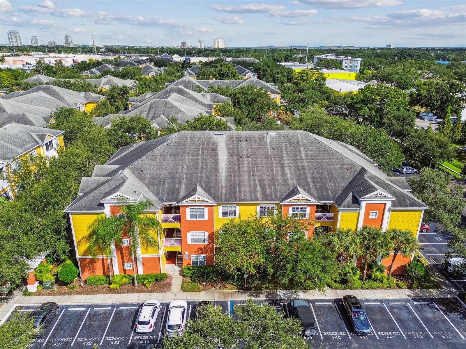 Welcome home to resort-style living at its finest! This beautifully updated 1-bedroom, 1-bath condominium combines comfort, convenience, and class in one of the area’s most desirable communities. Perfect for anyone looking for a stylish, low-maintenance home in a prime location. Step inside to find sparkling tile floors throughout, adding both beauty and easy upkeep. The modern kitchen features granite countertops, upgraded cabinetry, and ample space for cooking or entertaining. The open-concept layout seamlessly connects the living and dining areas, offering a light, airy atmosphere ideal for relaxing or hosting guests. Unwind on your private screened balcony overlooking tranquil greenery — the perfect spot to enjoy your morning coffee or evening breeze. The unit also features crown molding, a spacious bedroom, ample closet space, and an extra storage closet for added convenience. This gated community offers peace of mind with security from 7:00 PM to 7:00 AM, plus an impressive list of amenities that make every day feel like a vacation. Enjoy the sparkling resort-style pool, indoor basketball court, and modern fitness center inside the beautifully maintained clubhouse. You’ll also appreciate your own reserved parking spot and plenty of guest parking for visitors. Located in a prime area close to shopping, dining, major highways, and entertainment, this condo truly checks every box — location, lifestyle, and value. Don’t miss your chance to live where others vacation — Schedule your private showing today!