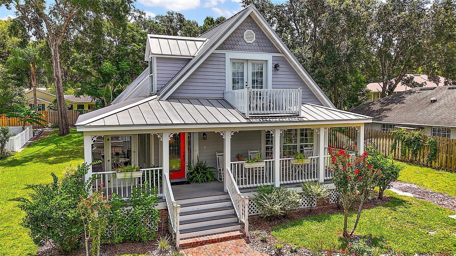 Storybook Charm in the Heart of Mount Dora
Nestled on a picturesque cobblestone street at the end of a private lane, 824 Michigan Street is a rare gem in the heart of downtown Mount Dora. Built in 2006, this storybook cottage is reminiscent of old-world charm and is part of the enchanting Mossy Oak Cottages—a quaint enclave of just four homes. With its timeless architecture and detached carriage house, this residence beautifully blends classic elegance with modern-day comfort.
Designed with historical character in mind, the home welcomes you with vintage-inspired architectural details, a charming front porch, and screened side and rear porches perfect for relaxing year-round. Inside, you'll find gleaming hardwood floors, crown molding, and an abundance of natural light throughout.
The inviting living room features custom built-in bookcases and a cozy gas fireplace that opens to the dining area—ideal for intimate gatherings. The kitchen boasts white cabinetry, stainless steel appliances, a gas range, pantry, and laundry closet, plus a delightful powder room and reading nook nearby. A versatile bonus room off the kitchen with custom built-ins and a built-in desk is perfect for a home office, library, or sitting room, with French doors opening to the screened back porch.
Upstairs, two spacious bedrooms share a full bathroom with tub and shower. The primary suite offers two closets and French doors that open to a beautifully restored balcony—an idyllic perch for enjoying sunsets, seasonal fireworks or watching seaplanes over Lake Dora.
The detached two-car garage includes a finished living space downstairs and a private-entry apartment above with a full bath—ideal for guests, a home office, or rental income.
Enjoy the best of Mount Dora living with an easy stroll or golf cart ride less than a mile to downtown’s boutiques, cafes, restaurants, parks, and scenic waterfront. Rarely available and rich in character, this home offers a truly special opportunity to own a piece of Mount Dora’s charm.
Don’t miss your chance to make this one-of-a-kind property your own!