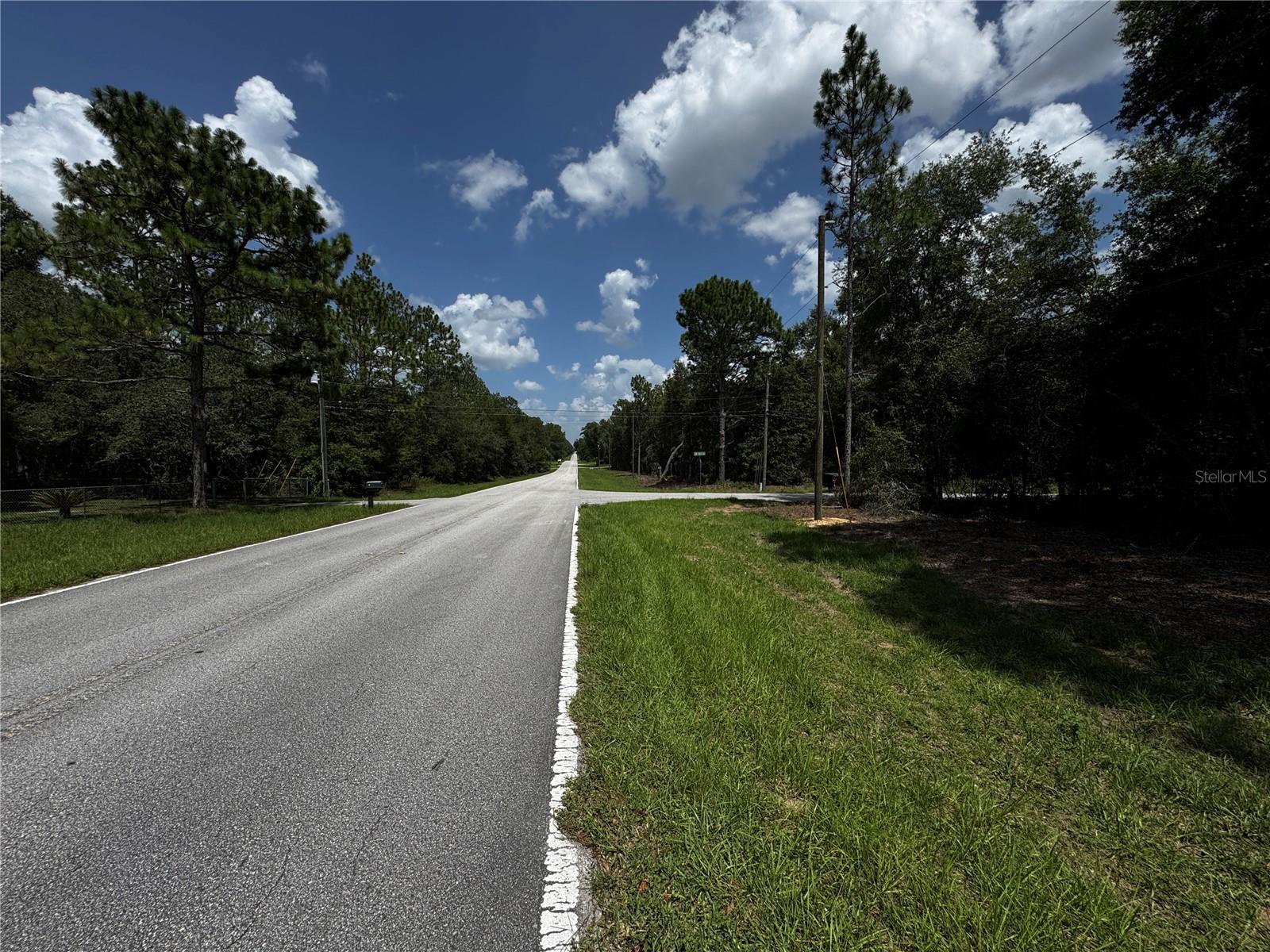 Spacious 1.06-acre corner lot located in Rainbow Lakes Estates, Dunnellon, FL.
This buildable and flat parcel sits at the intersection of SW 54th Street and SE 106th Avenue, with electricity available on both sides. Surrounded by new construction homes, this area is growing rapidly, making it an excellent investment opportunity. Just minutes from Rainbow Springs State Park and the Rainbow’s End Golf Club.
Corner lots like this are rare to find—especially at this price. Don't miss out—priced to sell quickly!