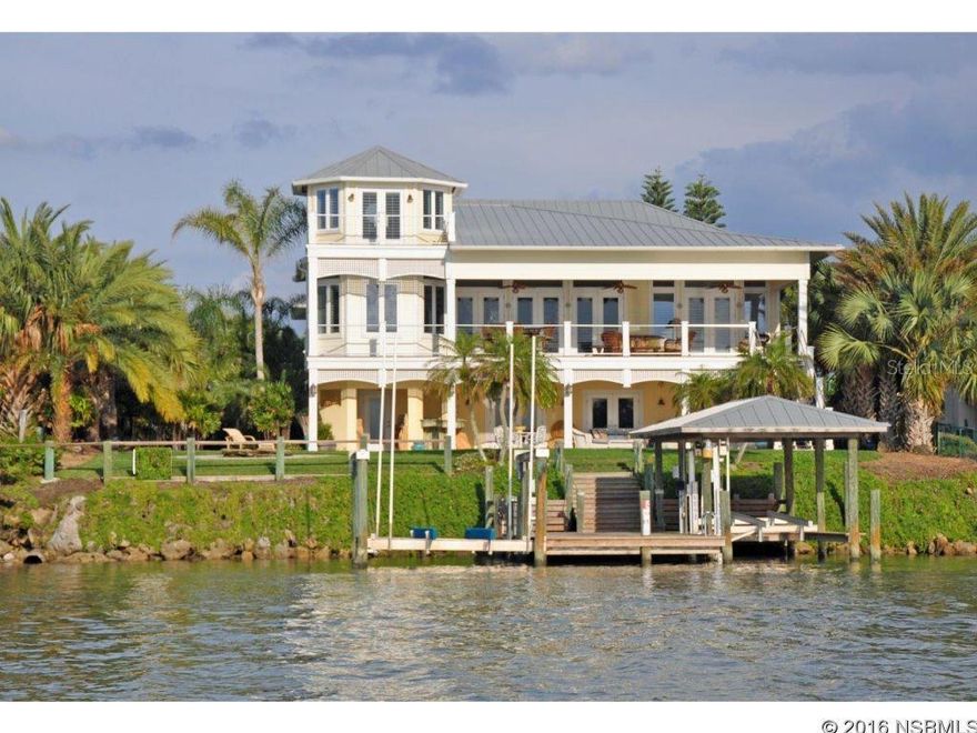 Under contract taking backups. Soaring above the Intracoastal & just a block from the beach, this fabulous home offers wonderful privacy & lots of indoor & outdoor living space including deepwater dockage with both covered & open boat lifts & 4+ car garage!   Extensive woodwork throughout.  Viking appliances, elevator, plantation shutters, wood flooring, granite. Amazing detail!  Livingroom, diningroom & master suite with French doors all open onto 41â veranda.  First level 40â family room with bar, opens to lanai with summer kitchen.  Separate upstairs wing includes 2nd master suite with screened porch, plus 2 more bedrooms & baths.  Downstairs wing includes great room, bath & private porch making ideal in-law quarters or easily accessed home office if needed.   Third level rooms include both private river & ocean view study with built-ins & river room that provides vistas for miles!  If more bedroom space is needed, thereâs a bunk room that adjoins another bath.  With the study, in-law area & other flex space, this home can easily accommodate a family or corporate retreat requiring 5-7+ bedrooms!   Enjoy sunset views on the Intracoastal, the Ponce Inlet Lighthouse & peeks of the ocean, too.   Sq footage is approximate.  Gas water heater, 4 HVAC units (replaced 2013, 2014, 2014, 2015).  Covered boat lift 5,000 lbs, open lift 16,000 lbs.    Qualified showings by advance appointment only. ;Water: City