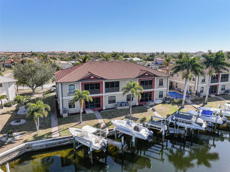 Experience the best of Punta Gorda waterfront living at 1323 Mediterranean Drive #212 — a beautifully appointed 3-bedroom, 2-bathroom condo with a 1-car garage and deeded boat slip, perfectly positioned along a serene saltwater canal. For added peace of mind, the roof, A/C, and water heater were all installed in 2023, offering valuable updates and long-term confidence for the next owner.

From the moment you step inside, you’ll appreciate the light-filled, open layout designed to embrace the views. Expansive sliding glass doors in the living room, primary suite, and one of the guest bedrooms create seamless indoor-outdoor living while showcasing peaceful water views and inviting coastal breezes.

The spacious kitchen is both functional and welcoming, featuring ample counter space, generous cabinetry, and an easy flow into the dining and living areas — ideal for entertaining or everyday comfort. Whether hosting friends or enjoying a quiet evening at home, this layout offers flexibility and style.

The primary suite is a true retreat with private lanai access and tranquil canal views. The en-suite bathroom offers dual vanities, a relaxing spa tub, and a separate shower — creating a comfortable, spa-like atmosphere. Two additional bedrooms provide versatility for guests, a home office, or seasonal living, with one guest room also enjoying direct lanai access.

Step outside to the large screened lanai, where you can sip your morning coffee, unwind at sunset, and watch boats glide by along the saltwater canal. With your deeded boat slip just steps away, you’ll have convenient access to Charlotte Harbor and beyond — making this an exceptional opportunity for boating enthusiasts.

Residents enjoy access to a community pool, perfect for cooling off on warm Florida days, along with the convenience of a private garage for storage and parking. Located in desirable Punta Gorda Isles, this waterfront condo offers the ideal blend of boating lifestyle, low-maintenance living, and stunning canal views — all just minutes from downtown Punta Gorda’s dining, shopping, and waterfront parks. Whether you’re seeking a seasonal retreat or full-time waterfront residence, this property delivers the Florida lifestyle you’ve been dreaming of.