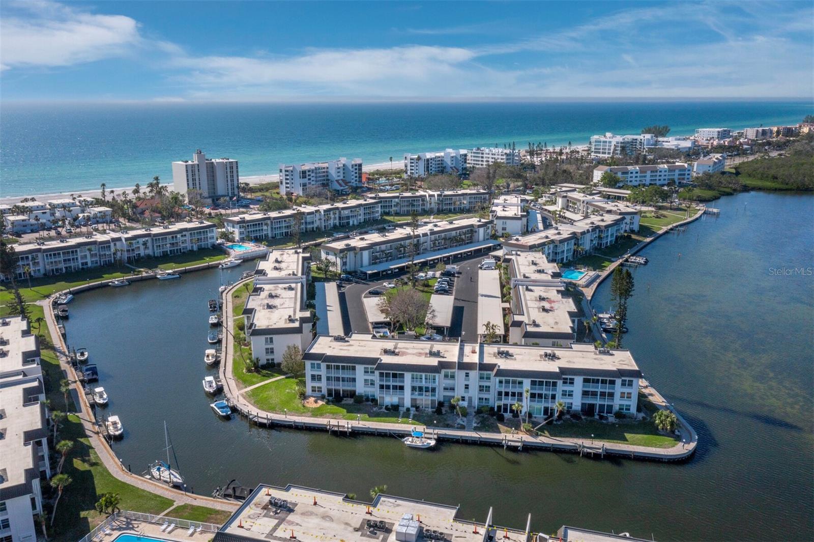 Waterfront Paradise – Move-In Ready 1-Bedroom Condo with Income Potential .Live the dream in this beautifully furnished, move-in ready one-bedroom condo located in a premier waterfront community on Longboat Key . From the moment you step inside, you’re greeted with tasteful coastal décor, a bright and airy layout, and water views of the harbor through your fully enclosed lanai. Slide open the glass doors and enjoy gentle breezes and serene water views right from your living space — the perfect setting for morning coffee or sunset cocktails. This condo isn’t just a peaceful retreat — it’s also an incredible investment opportunity. Begin earning rental income from day one with a unit that’s already well-appointed and ready for guests. The community is truly one-of-a-kind, offering a rich array of resort-style amenities. Enjoy exclusive access to a private, gated parking lot beach with indoor facilities, or take advantage of the four heated swimming pools scattered throughout the beautifully maintained grounds. For boating enthusiasts, docks are available on a first-come, first-serve basis and can accommodate both powerboats and sailboats up to 34 feet. Staying active is easy with a spacious, well-equipped fitness center, tennis and pickleball courts, and a banquet hall complete with a dance floor for social events. Creative minds will love the dedicated art studio, while the billiard room offers a great way to unwind. There's even private storage, an assigned covered parking space, and plenty of guest parking available for visitors. With a brand-new roof already in place and no special assessments, this is carefree coastal living at its best. Whether you’re looking for a seasonal escape, a full-time residence, or a high-demand rental, this condo is your gateway to the relaxed, waterfront lifestyle you’ve always wanted.