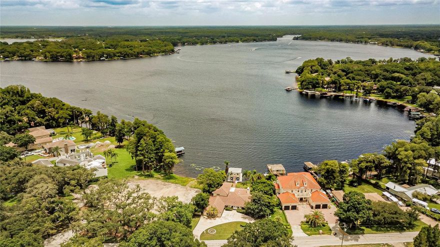 A 2 STORY 5 BEDROOM 3 BATHROOM 4000 SQFT HOME THAT HAS GLASS SLIDERS ACROSS THE WHOLE BACK OF THE HOUSE, WITH WIDE OPEN WATERFRONT VIEWS WITH A BOATHOUSE DOCK THAT HAS AN APARTMENT THE SIZE OF A STUDIO. THE SUNSETS ARE INCREDIBLE. HAS A CIRCULAR DRIVEWAY AND A STAIRCASE WITH A BALCONY OFF THE MASTER SUITE OVERLOOKING THE LAKE. BE ON VACATION EVERYDAY. THIS PROPERTY HAS AN OPEN FLOOR PLAN AND IS GREAT FOR PARTIES AND FAMILIES. THE PROPERTY HAS A STAINLESS STEEL FRIDGE, OVEN, RANGE, DISHWASHER,STOVE AND WASHER AND DRYER