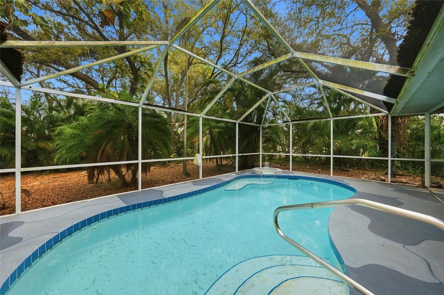 PRIVATE POOL HOME WITH SPACIOUS LAYOUT, TALL CEILINGS, AND A PEACEFUL NATURAL SETTING IN NORTH PORT! Tucked away in a QUIET RESIDENTIAL NEIGHBORHOOD, this well-maintained 3 BEDROOM, 2 BATHROOM, 2-CAR GARAGE home offers a comfortable layout designed for both everyday living and relaxing Florida outdoor enjoyment.

Step inside and immediately notice the TALL CEILINGS and bright, open feel that enhance the main living areas. The home features both a FORMAL LIVING ROOM AND A SEPARATE FAMILY ROOM, providing plenty of flexibility for entertaining guests, creating a media space, or setting up a home office or play area.

At the heart of the home is the LARGE KITCHEN, offering generous cabinet and counter space with room to gather, cook, and stay connected to the surrounding living areas. The layout allows for easy flow between the kitchen, family room, and outdoor spaces—perfect for hosting or everyday convenience.

The PRIMARY SUITE serves as a relaxing retreat, featuring HIS AND HERS WALK-IN CLOSETS for ample storage and SLIDING GLASS DOORS THAT OPEN DIRECTLY TO THE POOL AREA, creating a seamless indoor-outdoor connection and a peaceful place to start or end your day.

Step outside to enjoy your PRIVATE POOL AREA, where the SECOND BATHROOM PROVIDES DIRECT POOL ACCESS, making outdoor living and entertaining easy and convenient. The property is SURROUNDED BY TREES, offering a sense of privacy and a natural backdrop that enhances the peaceful setting.

With its SPACIOUS FLOOR PLAN, HIGH CEILINGS, MULTIPLE LIVING AREAS, AND PRIVATE POOL, this home presents an excellent opportunity to enjoy the best of the Florida lifestyle while still being close to local shopping, dining, parks, and everyday conveniences that make NORTH PORT such a desirable place to live.