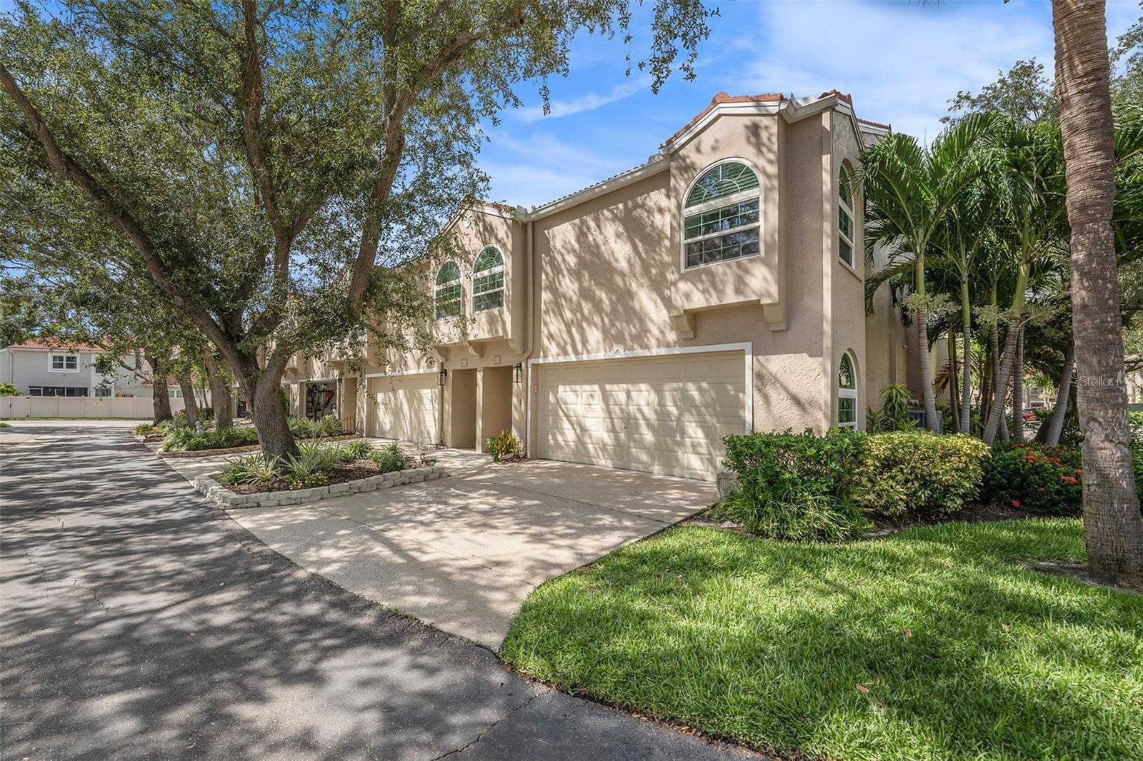 Beautiful 4 bedroom, 3 full bath, 1950 sq/ft townhome style end unit in the gated community of Placido Bayou. This home has many upgrades including a new tile roof, a new A/C system and ductwork, a whole house water conditioner, remodeled bathrooms, tile and wood floors, and hurricane rated sliders and windows. The main living area of this home is perfect for entertaining. It features a great open floor plan with cathedral ceilings, lots of windows and skylights, and wood floors. The kitchen features lots of cabinet space, solid surface counter tops, a tile backsplash, and a huge peninsula. The main level also features a bedroom and full bath. Upstairs this home features 3 more bedrooms, and 3 more renovated full bathrooms including a huge primary suite featuring high ceiling, plenty of closet space, and an updated private master bath with a large tiled shower, granite countertops, and dual sinks. Don't forget the private drive way, attached garage, and screened in porch. All this in the gated, with guard 24/7, community of Placido Bayou located minutes to shops, restaurants, and downtown St Petersburg.