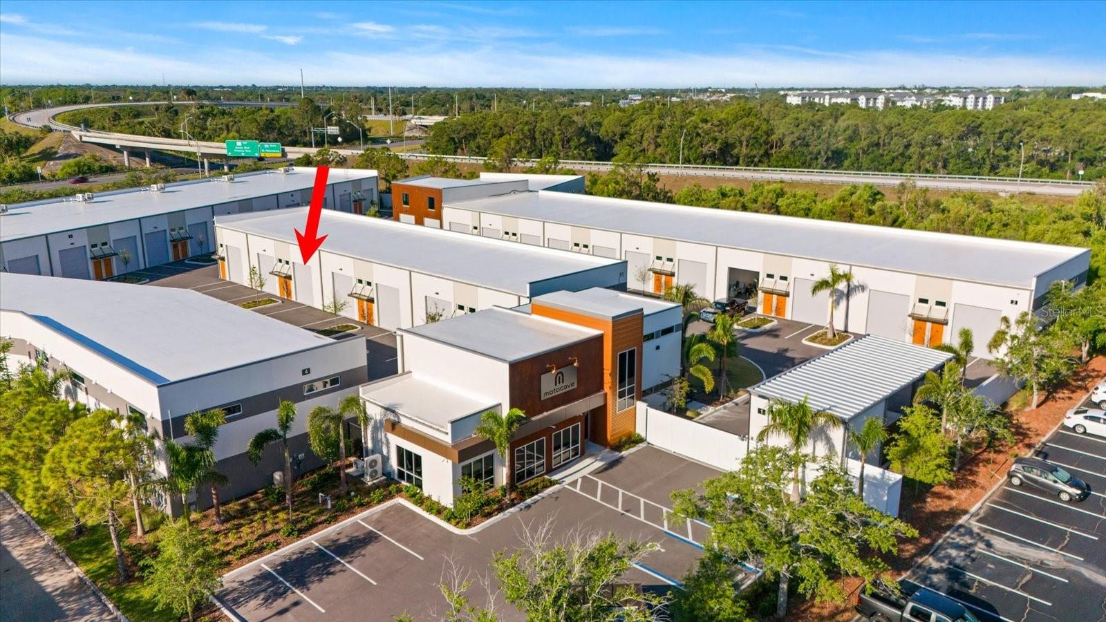 Welcome to Motocave, the ultimate haven for luxury motor storage, designed with the needs of serious car collectors in mind. This first-of-its-kind project in Pinellas County sets a new standard in vehicle storage, offering security, convenience, and community—all within easy reach of the Greater Tampa Bay region. Unit 304 is conveniently located near the Clubhouse, climate-controlled and 960 sq ft with soaring ceilings, epoxy flooring and is equipped with a private bathroom.
Spanning 3.7 meticulously developed acres, Motocave provides peace of mind with reinforced concrete perimeter walls, an automatic security gate, and a robust concrete block and precast roof structure engineered for durability. Whether you're storing exotic cars, vintage classics, or high-performance machines, your investment is protected with fire sprinklers throughout, oversized roll-up doors, and high-clearance units built to accommodate even the most unique collections.
More than just storage, Motocave features an exclusive luxury Clubhouse where owners can connect, relax, and share their passion with fellow enthusiasts. This is not just a place to store cars—it’s a destination built for the collector lifestyle. Schedule a private tour today and take advantage of this amazing value!