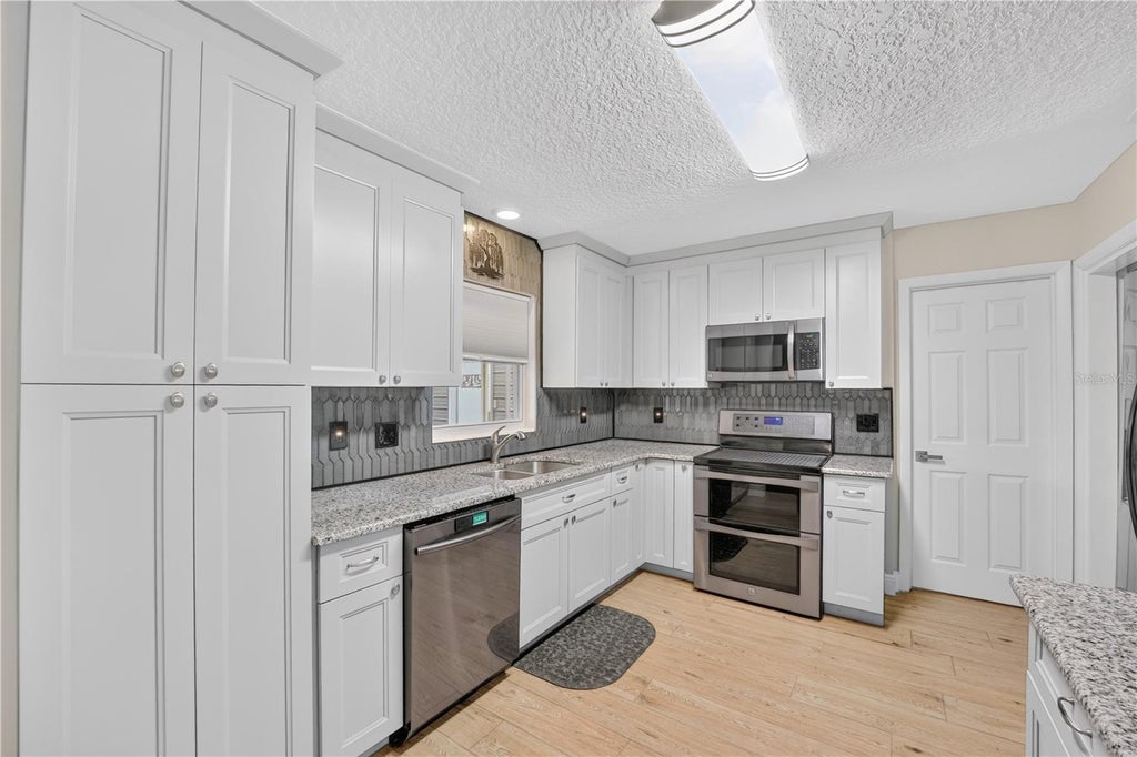 Photo of 28050 Lois Dr, Tavares, FL 32778 (MLS # O6438235)
