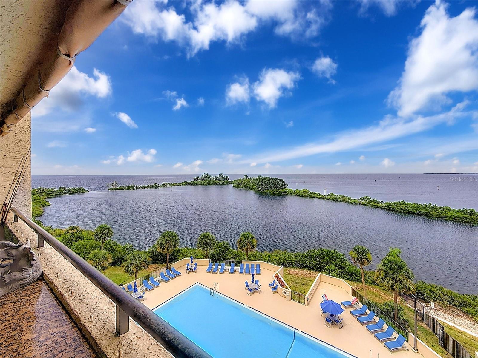 UNPARALLELED BEAUTY AND MESMERIZING GULF FRONT SPARKLING WATER VIEWS. This one is an absolute showstopper with tranquility beyond compare surrounded by water and nature right on the Gulf of America! RARE Opportunity to experience elegant relaxation in the NEW walk in tub with spa jets, a $20,000 improvement. Upgraded and beach decored to absolute perfection this residence is sure to impress even the most discriminating of buyers. Artistically designed oversized Chef's domain features multitude of pristine white cabinetry, expansive gleaming granite counters , stainless steel appliances including built in beverage cooler, and cordinating tiled backsplash ensuring both functionalityand aesthetic appeal. Ensuite master bedroom boast new stainless ceiling fan, granite counter vanity, and custom tiled walk in shower with glass door. The interior flows beautifully with an open and airy floor plan with stunning water views from the kitchen through the great room and master suite through the 2 huge NEW Hurricane impact sliding glass doors. Guest suite features stainless ceiling fan , extra built in Closet and dresser draws . Custom built in Granite tables in dining room and on the gulfside balcony. Additional amenties include laundry closet with brand new dryer , Loads of extra custom storage cabinetry everywhere including in kitchen, dining, and both bedrooms , and Hurricane protection curtains for storm protection. Relax on your open air private balcony with your favorite beverage or meal enjoying your "Nature's Paradise" soaking in the soothing summer sunsets and watching the dolphins swim , manatees float, and birds soar by. Condo coveniently located a few steps from the brand new elevators. The island oasis is surrounded by water except for the 24/7 guarded entry for your upmost security. This resort style neighborhood features beautiful olympic sized temperature controlled swimming pool, private sandy beach, Nature's trail,sunbathing promenade overlooking sparkling lagoon, waterside picnic area, tennis & pickleball courts,fishing, and kayak storage. Mingle with friends and family in the remodeled clubhouse boasting large function room where the community features multiple social events during the year , two game rooms,waterfront fitness center with locker rooms, and a fully equipped workshop. Assigned parking spaces and boat slips in the community Marina become available to purchase or rent occasionally. The monthly maintenance fee includes all amenities, 24 hour guards, and all the utilities including cable and Wifi except electricity. Milestone Inspection is done and minor repairs completed with no special assessments as have been common in other area waterfront condo communities. Ideally located in quiet Hudson Beach close to waterfront restaurants and casual beach bars that are easily accessible by boat or vehicle. Enjoy multiple area State Beaches and Parks, golf courses, shops, and the close by Sun West Water Park. Easy access to all that the Tampa Bay and the St Pete/Clearwater areas have to offer day or night. THis community is one of the Best Waterfront values and Best kept secrets around. View the community tour to walk along the Nature's Trail , past the beach & pool , through the clubhouse, and fly over the community. Live the great Florida Gulf front lifestyle without the fear of being flooded !! Call today for Your Virtual or Private in person viewing. Why buy any of the rest when you can have the BEST!!
