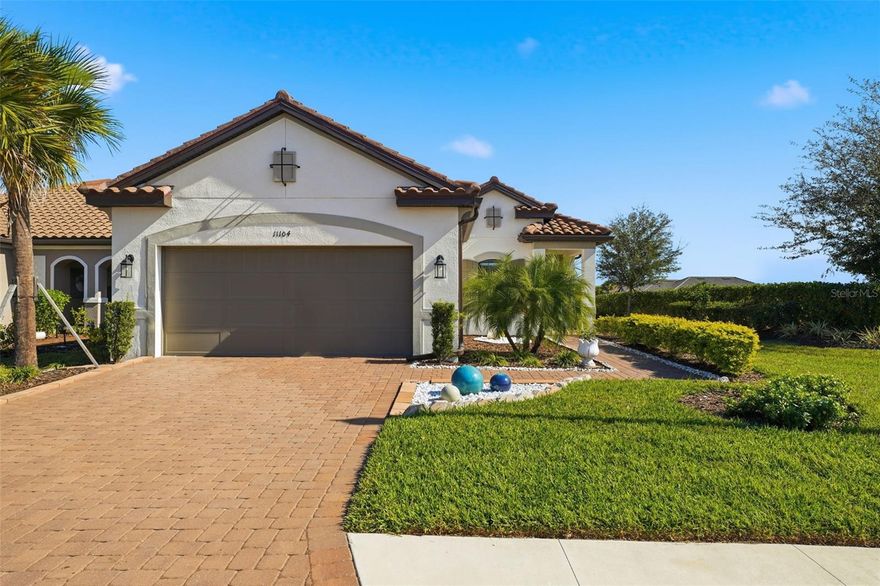 A SUN-SOAKED RESORT RETREAT! Welcome to upscale, resort style Florida living at it's best! Treat yourself to a fabulous new home in the new year and live where you can feel like you are on vacation everyday. This darling 3Br/2.5ba quality built Taylor Morrison home is situated on a large corner lot with serene lake views. This Matera floorplan offers a very light, bright, open and airy greatroom layout. The original owner has thoughfully upgraded and switched out lots of the standard builder included features. The home showcases upgraded light fixtures and ceiling fans throughout, gorgeous decorator tile on the Master bathroom wall, the kitchen island and backsplash, glass shower enclosures and upgraded plumbing fixtures in the Primary and Guest baths, designer mirrors in the baths, upgraded shower heads, and a Simply Safe alarm system. Other outstanding features this home has to offer include gorgeous plank style ceramic tile floors throughout the living area, solid surface countertops, stainless steel appliances, brand new washer and dryer, tankless hot water heater, large screened enclosed super sized extended lanai with rough in for a future outdoor kitchen. The HOA fee includes yard maintence, irrigation and cable/internet. This upscale gated community hands down offers some of the best amenties around which include a lifestyle instructor, multiple resort style pools, hot tubs, on site spa/therapy room, state of the art fitness center, tennis courts, pickleball bocci, firepits, cornhole, walking trails, dog park and more! This community is conveniently located to lots of brand new shopping, restaurants and I-75. A quick and easy commute to the Tampa/St. Pete area and quick and easy access to downtown Bradenton and Sarasota. This premiere community has it all!