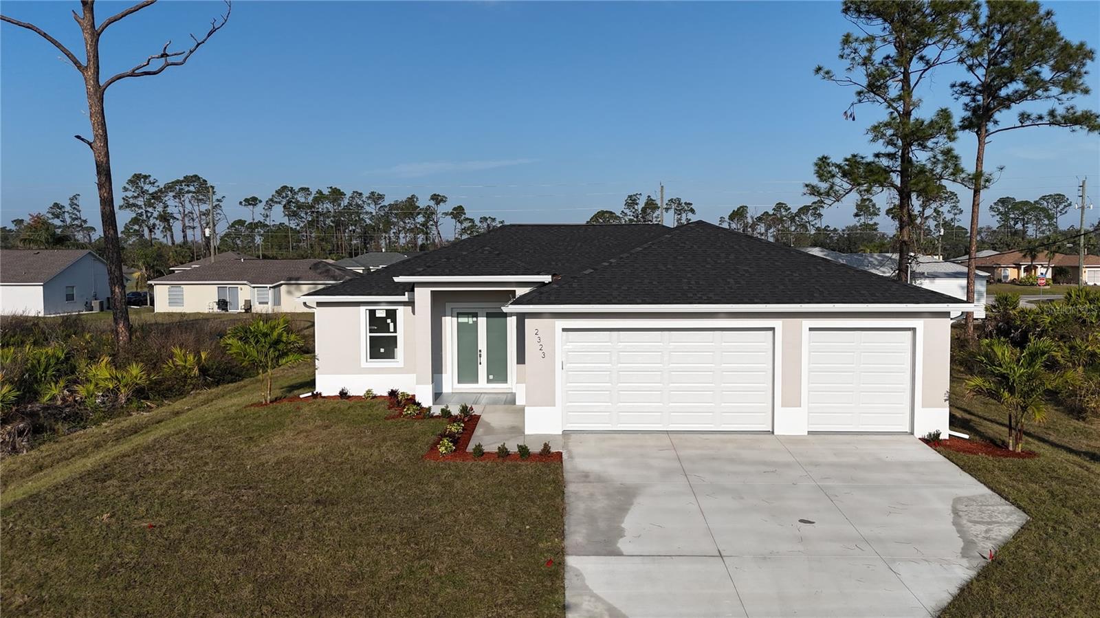 NEWLY CONSTRUCTED HOME (Seller Offering $5,000 towards closing cost) -Tucked away on a quiet street in one of North Port’s most desirable neighborhoods, this beautifully maintained 3-bedroom, 2-bathroom and 3 CAR GARAGE with HURRICANE-IMAPCT WINDOWS, NO FLOOD ZONE (X ZONE) home offers the perfect blend of comfort, space, and Florida charm. From the moment you arrive, you’ll be drawn to the home’s clean curb appeal, mature landscaping, and serene north-facing front exposure, ideal for shaded afternoons on the porch.
Step inside to discover a bright, open-concept layout with soaring almost 10 FOOT CEILINGS and tile flooring throughout the main living areas. The split-bedroom floor plan offers privacy for the spacious primary suite, complete with a walk-in closet and en-suite bath. The heart of the home is the inviting kitchen featuring ample cabinetry, a breakfast bar, and a cozy dining nook perfect for everyday living or entertaining.
Sliders open to a screened lanai, providing a tranquil spot to relax with your morning coffee or evening glass of wine. The large backyard offers plenty of room to add a pool or garden oasis—bring your vision to life!
This home offers easy access to Manasota Key Beaches, Warm Mineral Springs, Parks, Nature Trails, Less than a mile away from Grocery Stores and an array of shopping.