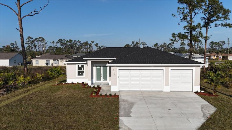 NEWLY CONSTRUCTED HOME -Tucked away on a quiet street in one of North Port’s most desirable neighborhoods, this beautifully maintained 3-bedroom, 2-bathroom and 3 CAR GARAGE with HURRICANE-IMAPCT WINDOWS, NO FLOOD ZONE (X ZONE) home offers the perfect blend of comfort, space, and Florida charm. From the moment you arrive, you’ll be drawn to the home’s clean curb appeal, mature landscaping, and serene north-facing front exposure, ideal for shaded afternoons on the porch.

Step inside to discover a bright, open-concept layout with soaring almost 10 FOOT CEILINGS and tile flooring throughout the main living areas. The split-bedroom floor plan offers privacy for the spacious primary suite, complete with a walk-in closet and en-suite bath. The heart of the home is the inviting kitchen featuring ample cabinetry, a breakfast bar, and a cozy dining nook perfect for everyday living or entertaining.

Sliders open to a screened lanai, providing a tranquil spot to relax with your morning coffee or evening glass of wine. The large backyard offers plenty of room to add a pool or garden oasis—bring your vision to life!
This home offers easy access to Manasota Key Beaches, Warm Mineral Springs, Parks, Nature Trails, Less than a mile away from Grocery Stores and an array of shopping.