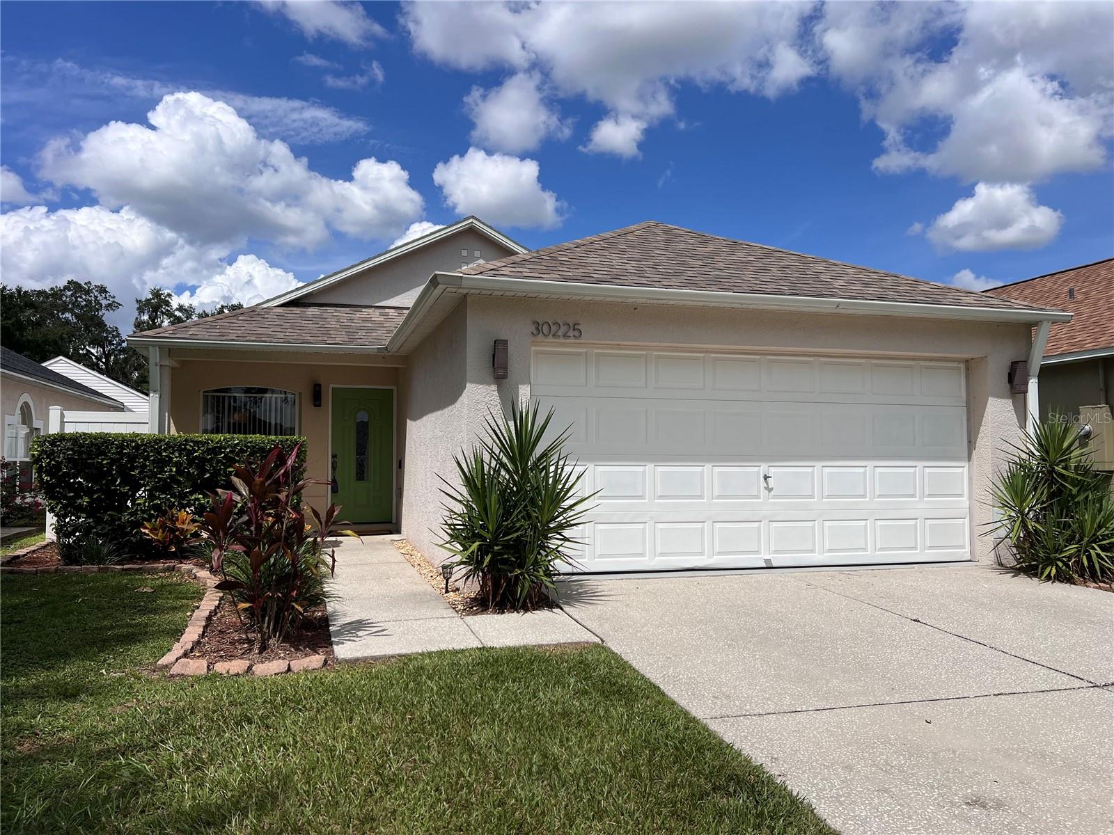 Charming, fully furnished 3-bedroom, 2-bathroom home in the heart of Wesley Chapel, featuring a 2-car garage, stylish porcelain baseboards, and flooring for elegance and durability. Enjoy a remodeled bathroom, modern recessed LED lighting, newer Samsung appliances (refrigerator, dishwasher, washer, dryer), and a 2021 AC for year-round comfort. A water treatment system with a filtered kitchen spout ensures clean drinking water. Thoughtfully upgraded, this inviting home is centrally located near top schools, shopping, restaurants, outlet malls, a sports complex, and I-75, offering seamless access to all Wesley Chapel amenities. Experience beauty, comfort, and convenience in this fantastic rental!