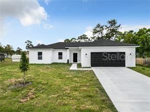 Builder offering $5,000 in closing costs!!! Come and Customize your home. Builder is giving you tje option to pick your kitchen color cabinets and floors. All pictures are examples of the finishes of the home you still have time to change colors. Also builder is providing the options of adding tile in the bedrooms. Come take a look at this 4 bedroom, 2 bathroom, Modern New Construction Home. Minutes from the Ocala World Equestrian Center, Fishing Lakes, Amazon New Warehouse, and Shopping Center. Builder is allowing you to pick from 3 different color schemes and personalize your home. Built on a spacious lot and close to some many attractions this could be the perfect home for you. Builder warranty included.