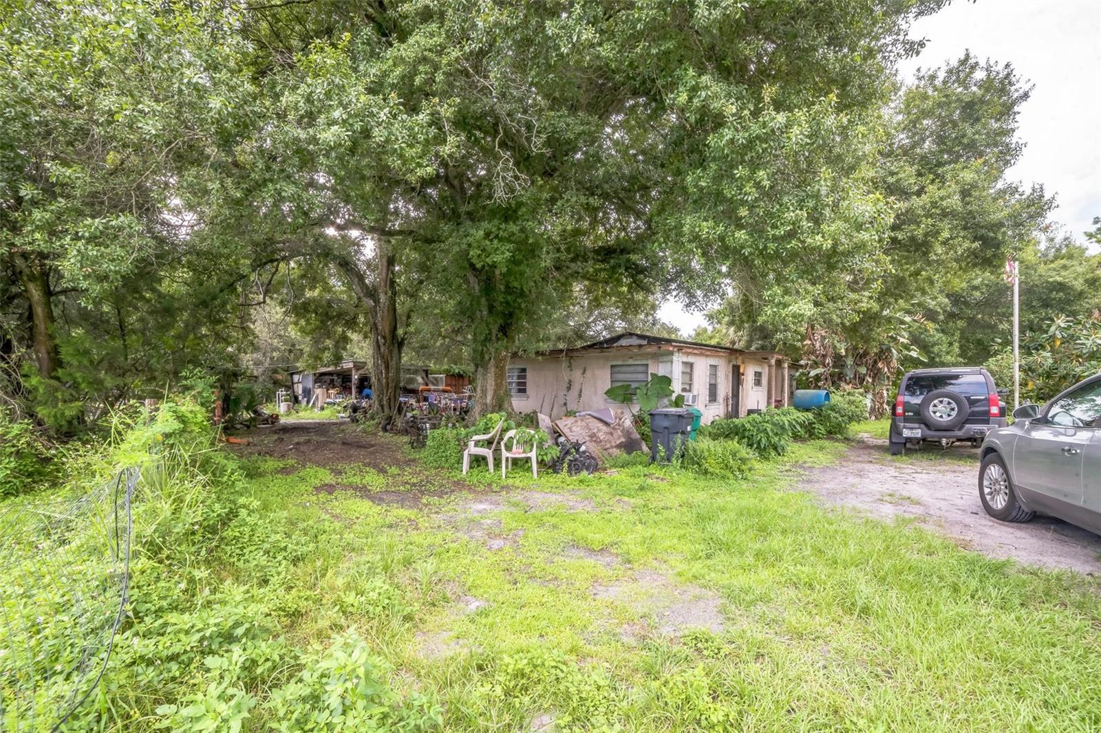 Investor Special! Rare opportunity to own a spacious 1,800 sq ft single-family home on 5 acres of land in peaceful Okeechobee. This property offers endless potential—whether you’re looking to rehab the existing structure or build new. Zoned for residential use with plenty of room for outbuildings, livestock, gardens, or RVs. Property is partially cleared and features mature trees, privacy, and easy access to main roads. Home will need full renovation—perfect for seasoned investors or buy-and-hold landlords. Tons of upside in land value alone. Don’t miss out on this blank canvas with acreage!