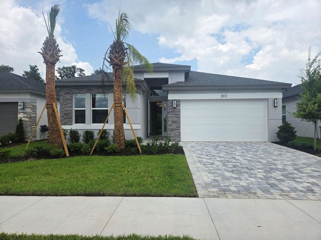 Photo of 3572 Malta Avenue, Wesley Chapel, FL 33543 (MLS # J1002645)