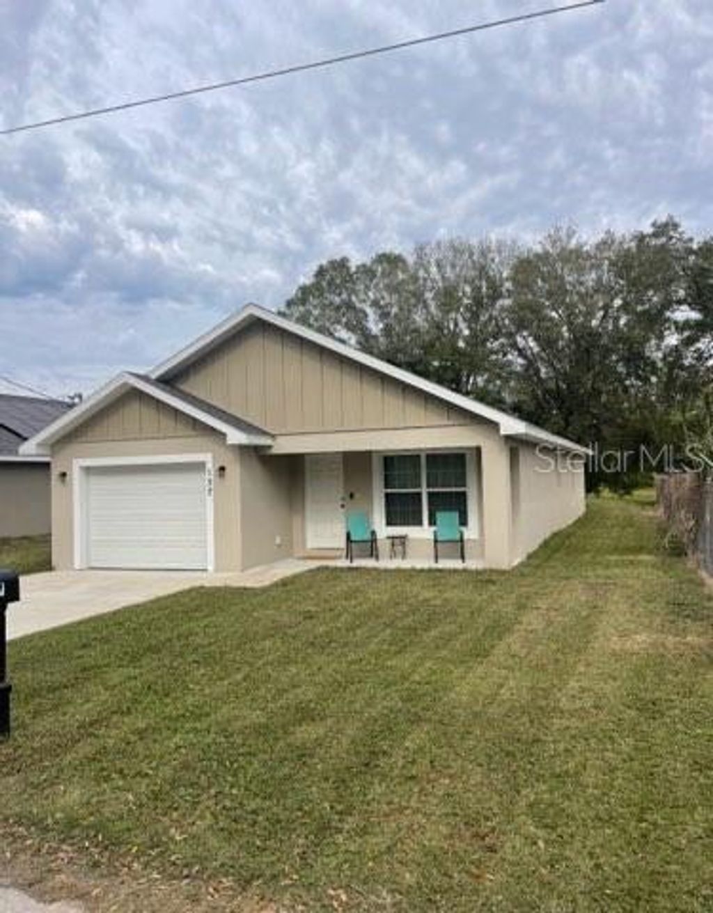 Photo of 137 Woodland Drive, Winter Haven, FL 33881 (MLS # L4958926)