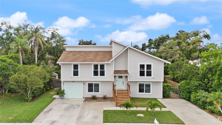 This home qualifies for a limited-time lender-paid 2-1 buydown! Enjoy reduced monthly payments for the first 2 years—at no cost to the buyer. Take advantage of an effective starting rate as low as 4.99%. Reach out to your agent for more details! MULTIGENERATIONAL DREAM HOME – Fully Remodeled, Dual Living Spaces, Huge Backyard & Luxury Upgrades! How would you like to own two homes in one? Upstairs feels like a one-of-a-kind cozy cabin retreat — you’ll definitely catch “cabin fever” in the best way. Downstairs offers the ultimate beach-inspired coastal vibes, reflecting the relaxed Sarasota lifestyle. Together, this home blends rustic charm with modern coastal living for a truly unique opportunity. Welcome to 8096 Glenbrooke Lane, Sarasota – a rare multigenerational/extended family gem in the sought-after Glenbrooke neighborhood. This immaculate 5 bedroom, 3 bath home has been fully remodeled and offers two complete separate living spaces, each with its own entrance, kitchen, laundry, and living rooms.
Ground level: 2 bedrooms, 1 fully remodeled bath, a brand-new kitchen with 2023 appliances, spacious living room, private laundry, and separate entry. Second level: 3 bedrooms, 2 full baths, another updated kitchen, dining room, bright living room, porch overlooking the huge fenced backyard, private laundry, separate entry, and a stunning electric fireplace with custom reclaimed wood surround. Upgrades & Features: bathrooms remodeled in 2023, house replumbed in 2018, new roof (2022 with 50-year transferable warranty), hurricane impact windows (2017), all appliances new (2023), vinyl siding updated in 2023, stucco freshly painted, dual HVAC systems, Sherwin-Williams exterior paint, extensive structural updates approved by inspection. Outdoor living: Large fenced yard with room for a pool, two lifetime vinyl storage sheds, extended driveway, and rebuilt front porch with custom railing. Located in a quiet, friendly neighborhood with low HOA ($300/year), no CDD fees, and in a preferred No Flood Zone area with no flood or hurricane damage. Minutes from Siesta Key Beach, Lido Beach, Longboat Key, UTC (University Town Center), St. Armands Circle, downtown Sarasota, and the airport. Enjoy Sarasota’s best shopping, dining, and cultural attractions including The Ringling, Van Wezel Performing Arts Hall, and Sarasota Opera. Nearby are top-rated schools, parks, and golf courses.