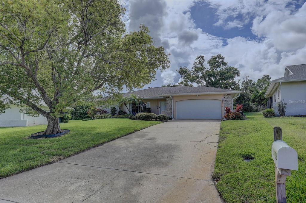 Photo of 13006 Pebble Beach Circle, Hudson, FL 34667 (MLS # OM704902)