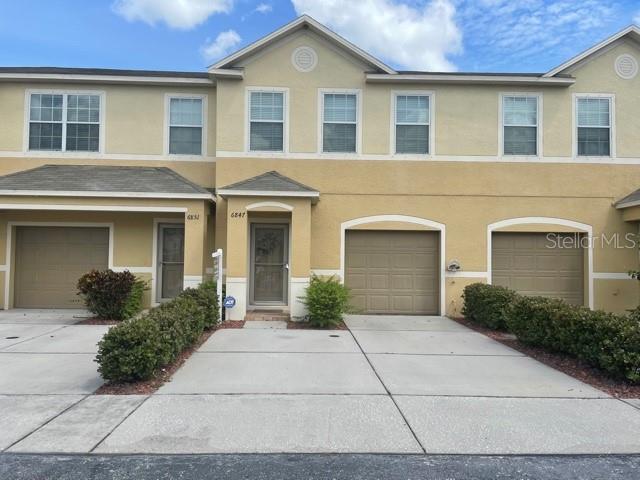 ANNUAL RENT. This beautiful townhouse located in the highly desirable Sawgrass Village Community, 3 bedroom, 2 1/2 bathroom with a one car garage with raised storage along with the 2 car driveway.. The open floorplan features the kitchen, Living and dining area on the first floor with ceramic tile floors and a half bath. The kitchen features wood cabinets and stainless steel appliances, including. The closet pantry provides that extra necessary storage! The living room is spacious and has sliding door access to the covered and screened lanai for some "outdoor sitting". All three bedrooms are upstairs with a split plan to provide for privacy. The master suite features a large walk-in closet and the bath tub and separate shower, along with a double vanity. The laundry room is located upstairs and the washer and dryer are included. The community offers a swimming pool and dog park and is centrally located to tons of shopping, Downtown St. Petersburg and the most beautiful beaches. Call for more information and showing appointment.