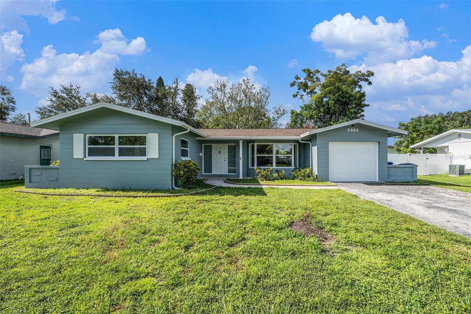 This beautifully renovated 3-bedroom, 2 bath residence combines contemporary style with everyday comfort, offering the perfect blend of luxury and functionality. The open floor plan provides a seamless flow between the living, dining, and kitchen areas—perfect for entertaining guests or relaxing with family. The kitchen comes fully equipped with custom cabinetry, sleek stainless appliances, ample countertop & prep space. Both bathrooms offer spa-inspired details featuring contemporary vanities and custom tile. The recently installed hurricane rated windows are an added bonus and provide enhanced energy efficiency and peace of mind for years to come! The home was topped with a new roof in 2020 and the electrical and plumbing systems where updated in 2025. The backyard is enclosed with brand new vinyl fencing with plenty of room for a pool. Centrally located in Pinellas County, Sheryl Manor is known for its friendly community atmosphere with neighborhood golf cart parades, food drives, and Northwest Recreation Center(JW Crate). Whether you’re heading to the beach, park, shopping, or dining out, everything you need is just minutes away. This home is truly move-in ready, offering all the modern updates you desire in a convenient, welcoming layout nestled in a great location. Don't let this one get away... Call today for a private showing!