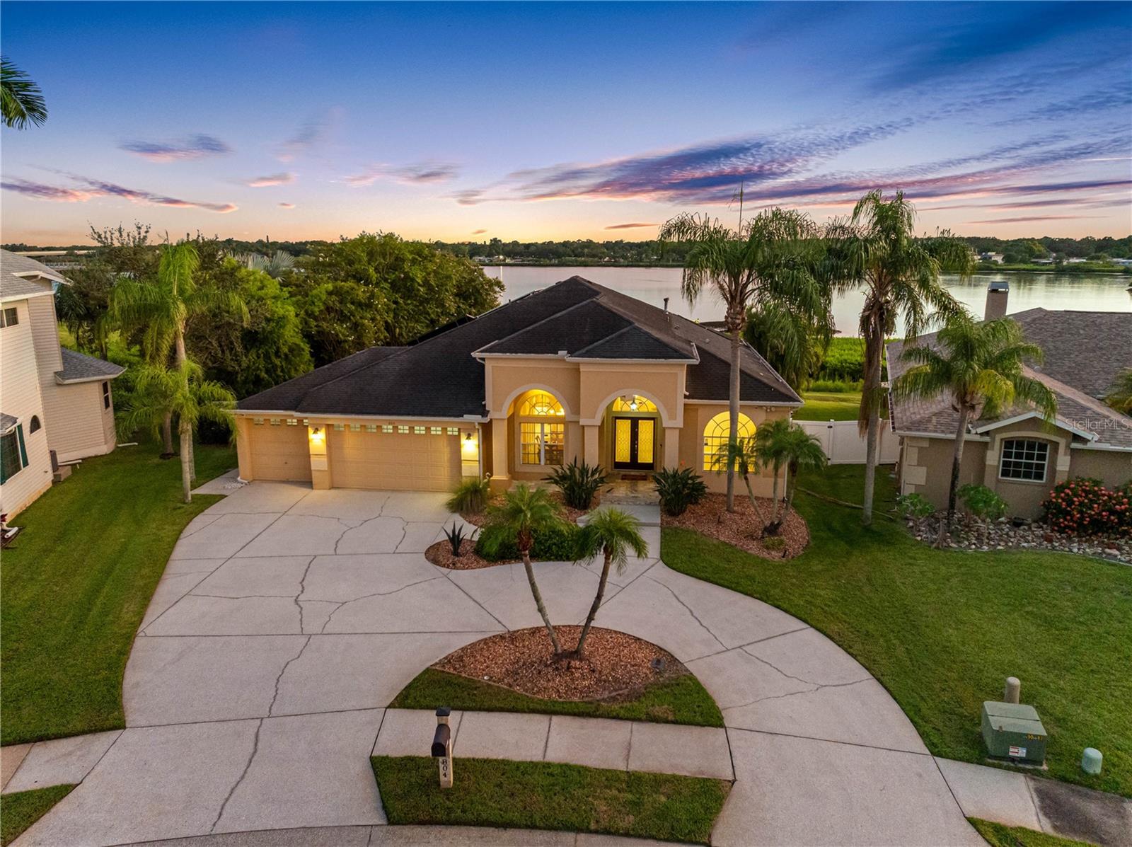 Welcome to your private waterfront retreat, the crown jewel of Bay's End. Watch manatees and dolphins in this tranquil conservation setting. This custom 4-bedroom, 3-bath residence blends timeless sophistication with modern comfort. Recently updated with high-end finishes, the home features high ceilings, solar panels (fully owned), a gorgeous pool and spa, screened-in lanai overlooking Tampa Bay, outdoor kitchen and a private (West-facing) dock for soaking in sunsets. Enjoy the privacy of a Main bedroom on it's own side of the house, with Bay views, 2 custom walk-in closets, and a spectacularly renovated bathroom with a deep soaking tub. Guest suite features a walk-in closet, en-suite bathroom, and it's own entrance to the pool. Open-concept kitchen with granite countertops and water views. The property is beautifully landscaped, including artificial turf, and boasts a 3-car garage. It's just a minute walk to the peaceful trails of Harbor Palms nature park. Nestled in an A-rated school district, this prime location offers quick access to the beach, top-rated restaurants, shopping, and the airport. Best of all, this house did NOT flood! Sellers proactively completed pre-inspection of home. Whether you're seeking a serene sanctuary or an entertainers dream, 804 Charles Blvd delivers it all.