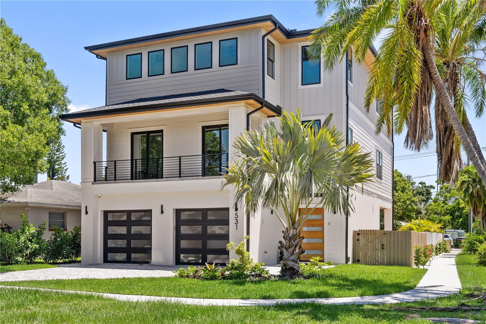 Welcome to this newly built luxury home on Davis Islands featuring 6-bedrooms and 5-baths with a private gas heated saltwater pool and spa. The main living area is located 17ft above sea level and built to last with hurricane impact windows/doors, upgraded zip system sheathing, and spray foam insulation. This home is also built for security and convenience with cameras and speakers throughout and each window pre-wired for shades all controlled through your secured Control4 system. As you enter the home you'll find ample parking in your four car garage plus a bonus area overlooking your private pool, perfect for a gym or entertaining. As you go up the stairs to your living area you'll first notice the real oak wood floors throughout and a fireplace centerpiece overlooking your pool balcony plus a potential wine closet. The gourmet kitchen features a butlers pantry with built-in espresso machine, coffee bar sink and 48-inch gas cafe range. To complete the second floor you'll find two bedrooms perfect for an office or guest room, hall bath and AV closet. As you continue to the third floor you'll find 4-ensuite bedrooms along with your laundry room. The master bedroom features a private balcony with views overlooking the Tampa Skyline, plus his and her walk-in closets. The spa-like master bathroom centers around your dual vanities and frameless glass shower with standalone tub. Additional benefits include closing cost incentives when using our preferred lender. Call today for your private showing!