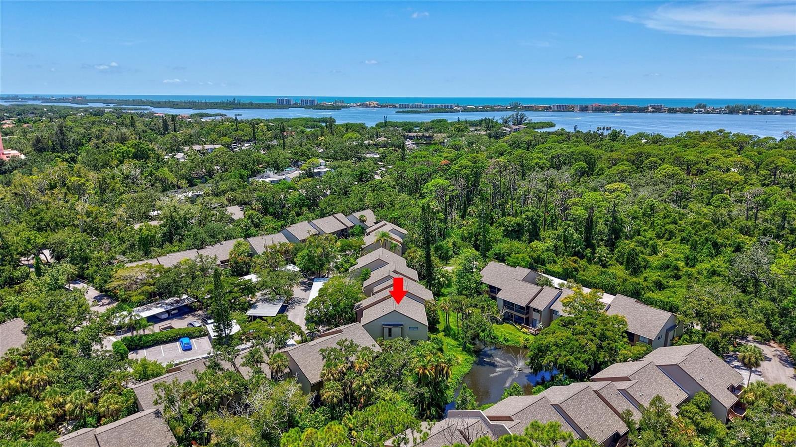Don’t miss this spacious, TURNKEY FURNISHED unit in Pelican Cove – Sarasota’s premier 75-acre, gated community along Little Sarasota Bay. Your updated 3-bedroom home is light and bright with vaulted ceilings, three balconies and water views. With a convertible 3rd bedroom with sleeper sofa, you have plenty of space for family and friends. The main balcony sliders can be opened to enjoy the sights and sounds from this lushly landscaped property. The interior has 20” tile throughout the unit. The updated eat-in kitchen has white cabinets, solid surface countertops and sliding glass doors to the 2nd balcony where you can enjoy your morning coffee. The primary bedroom has water views and sliding glass doors to the balcony. There are dual closets in the primary bedroom– one is a cedar lined walk-in. Both bathrooms have been refreshed with new vanities and granite countertops. A large laundry room is located off the balcony. Lots of closet space and attic storage is a plus. One of the communities six pools is just around the corner. Award-winning Pelican Cove has 3 Clubhouses that host year-round activities. There is a fitness room, studio space for art, photography and woodworking. The large auditorium is used for concerts, lectures and art shows. Miles of scenic pathways lead to tennis and pickleball courts and the community-friendly dog park. Visit the marina with 85 boat slips. There are kayak and the paddleboard launches and over 100 storage racks. Visit the fishing docks or spend time at the waterside gazebo. With over 35 social clubs, you can be as busy as you want. Best of all, Pelican Cove is close to Siesta Key beaches. Great shopping and restaurants are just minutes away. Feel close to everything while living in the Sarasota’s hidden gem.