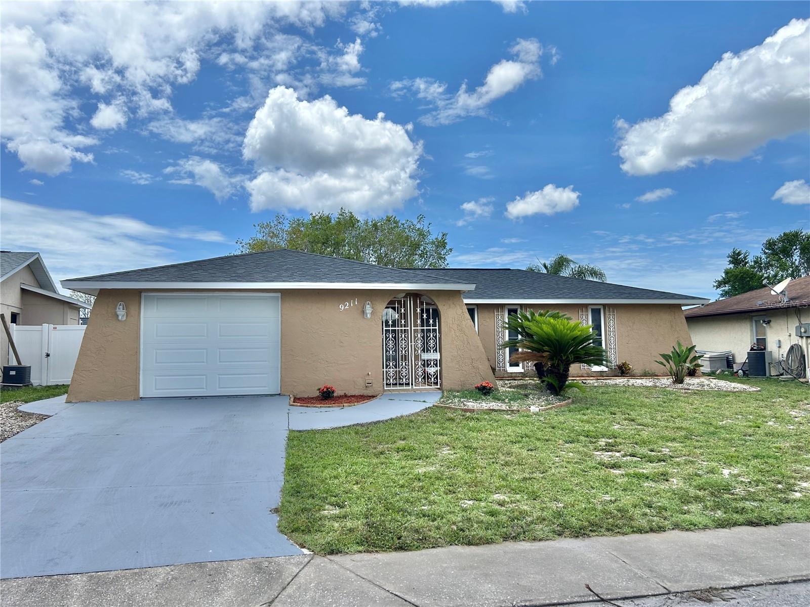 This 3/2/1 open floor plan home that looks brand new!! The custom kitchen has white shaker cabinets, Quartz counter tops, new stainless appliances, led recessed lights and new fixtures. The 2 large bathrooms have been redone from top to bottom(Quartz, marble, porcelain tile). There are new light fixtures thru-out the home. There is 24 in x 24 in porcelain tile flooring throughout the entire living space. New Window Treatments, new 5 1/2" baseboards, new 6 panel doors with hardware and new neutral paint inside and out. There is a fresh landscaping and a large fenced yard. CENTRALLY LOCATED Minutes to the gulf beaches, Anclote fishing pier and historic Tarpon Springs. Tampa and Clearwater airports are just a short drive. Huge outdoor patio in the newly fenced in backyard. THIS ONE WILL NOT LAST LONG.