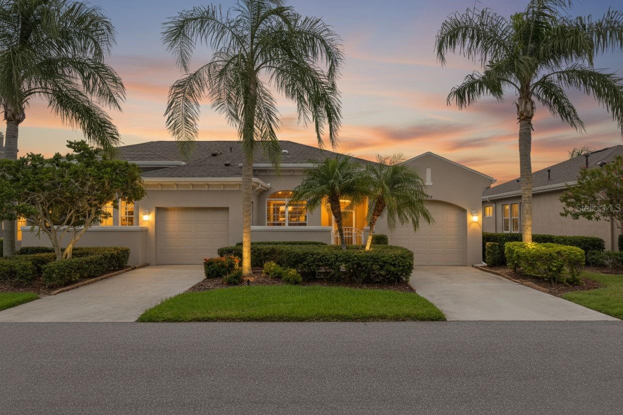 One or more photo(s) has been virtually staged. Welcome to this MAINTENANCE FREE lifestyle in the GATED community of Kings Point! Located on the 2nd hole of the Osprey golf course with AMAZING VIEWS! This condo is NOT in a flood zone, and THE LEASE INCLUDES cable, internet, pest control, water, sewer, trash, lawn care and access to activities that include over 200 clubs, multiple indoor/outdoor HEATED pools, fitness, PICKLE BALL, an onsite SALON, two restaurants and so much more! This Chelsea floor plan has a courtyard that provides outdoor living and a reception for your guests while the screened and covered porch provides shelter for your packages. Inside, the view of the ACTIVE GOLF COURSE is seen from the moment you enter! The foyer welcomes you with a striking tray ceiling with a height of 10 feet 8 inches, complemented by generous space ideal for a drop zone and bench seating. The living room boasts the same stunning high tray ceiling as the foyer and offers room for oversized furniture. The kitchen is a true culinary haven, featuring GRANITE countertops, a GAS range, stainless steel appliances, and an abundance of wooden cabinetry, complete with Lazy Susan corner cabinets and roll-out shelving. There is a pass-through into the living room which makes for ease of serving. The EXPANDED lanai measures an impressive 14 feet x 16.8 feet. You will enjoy watching golfers and observing nature, including a variety of birds, thanks to the unobstructed view and absence of immediate neighbors! The split floor plan includes a spacious primary bedroom that can easily fit king-size furniture, provides space for a sitting area, and boasts a tray ceiling. The en-suite bathroom has tall cabinetry, GRANITE countertops, dual sinks, a walk-shower with glass enclosure and a separate water closet. Storage is no issue with the spacious walk-in closet featuring wrap around shelving and 10’ ceilings. The second bedroom is filled with natural light, has several windows, a walk-in closet, and a nook that’s perfect for storing some of your furniture out of sight. This room has quick access to the second full bathroom which offers the same finishes as the primary along with a tub/shower enclosure. The third bedroom has double door access, a wall of windows that floods the space with natural light, and ample room to create an office while still accommodating a third sleeping area. The laundry room is equipped with the same updated cabinetry as the rest of the home. The TWO garages (12' x 21' each) and extended driveways provide MORE STORAGE ROOM and ease of parking than a two-car garage! This home is located close to the second entrance and South Clubhouse where you have one of three exterior pools that Kings Point offers to all residents! Enjoy fun, music, snacks, drinks and even water aerobics! The South Clubhouse also has one of two interior pools, fitness and a restaurant and bar where you can enjoy a beverage while watching the sunset! There are many events that take place including dances, parties and movie nights at the North Clubhouse! This home has a KPW Platinum Warranty which means peace of mind in addition to a BRAND-NEW HVAC system! The Property Management company is ON-SITE and ready to assist when needed! If you plan on venturing out there is quick access to restaurants, SHOPPING, beaches & 30 minutes to Tampa International Airport, less than an hour to the Sarasota shops and 20 minutes to Ellenton Prime Outlets!