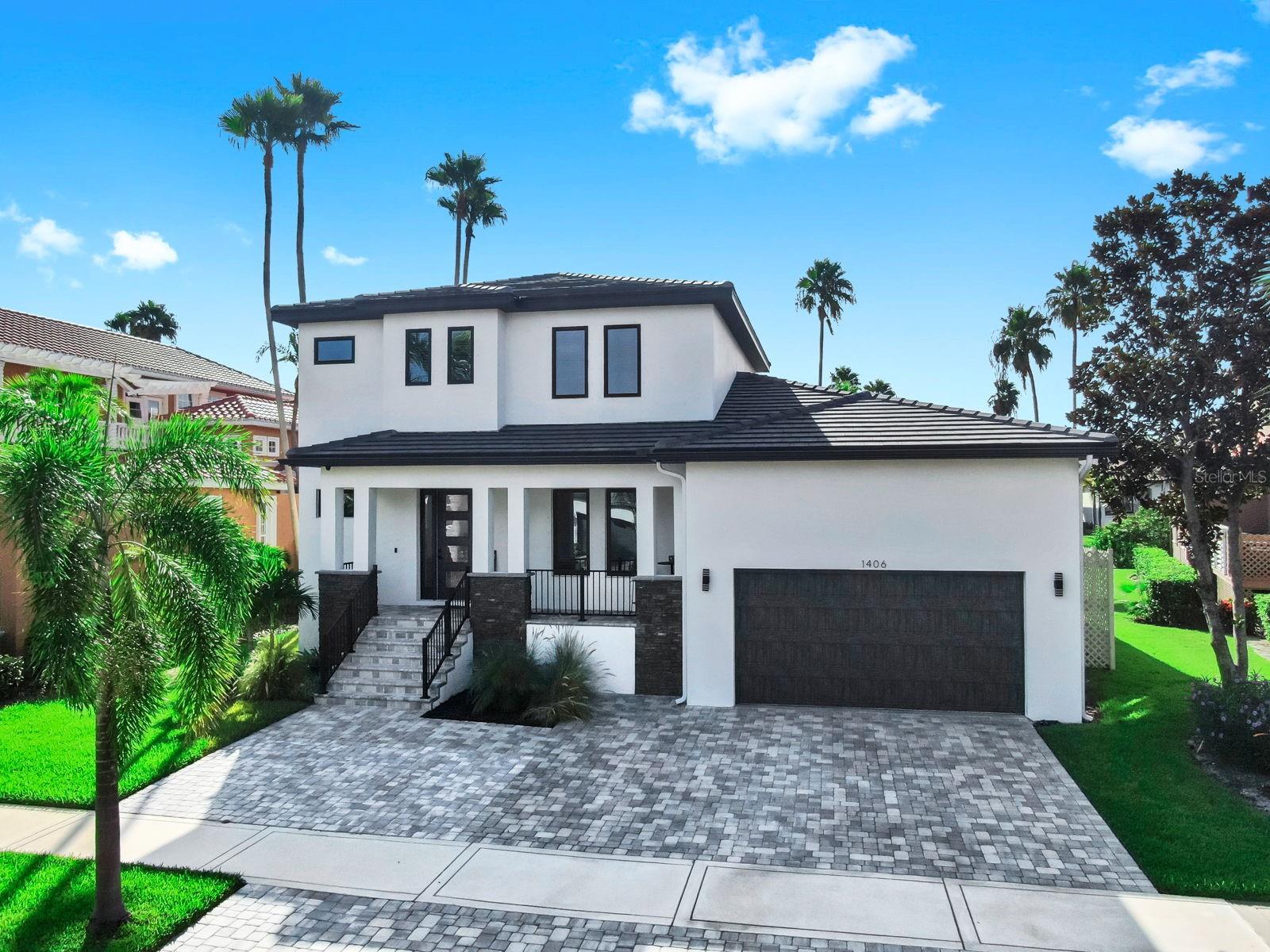 Welcome to this ONE-OF-A-KIND 2023 custom-built POOL home in the gated community of Andalucia. Offering five spacious bedrooms, four and a half bathrooms, and a private office, this home was designed with both comfort and elegance in mind. Luxury vinyl flooring flows throughout the main living spaces, with high-end wood laminate in the downstairs bedrooms, creating a seamless and stylish look. The chef's DREAM kitchen is the heart of the home, featuring a 10-foot island with storage, a range with oven plus a built-in wall oven, a vented microwave, and an abundance of cabinetry including a generous walk-in pantry. The dining area opens through French doors to the outdoors, while the living room boasts triple sliders that stack completely to the wall, extending your living space onto the screened lanai. Perfect for entertaining, the lanai overlooks a sparkling pool, fenced yard, and serene pond views, with a paved patio offering additional space for gatherings. The bright primary suite includes triple windows, two large walk-in closets, and a spa-like ensuite with dual sinks and a glass-enclosed shower. The guest suite downstairs features its own private bath and walk-in closet, while upstairs offers another ensuite bedroom plus two additional bedrooms with a shared bath. Back downstairs, a spacious office with barn doors, a convenient half bath, and a large walk-in storage area under the stairs complete the thoughtful layout. Technology meets lifestyle with surround sound in the living area and lanai, plus built-in WiFi extenders throughout. Tile roof with gutters. 5 foot extra bumped out space in garage for extra storage with EXTENDED driveway for 4 cars. Full home inspection already completed. Andalucia residents enjoy resort-style amenities including a Bayfront clubhouse with pool and sunset views, tennis courts, a playground, and basketball. This home truly blends luxury, functionality, and community in a way that is hard to find. Ideally located just minutes from Tampa, MacDill AFB, Brandon, St Pete, Sarasota, and Bradenton. Quick access to I-75, US Hwy 41, Hwy 301 with easy drives to Florida's top beaches, Orlando attractions, and several airports.