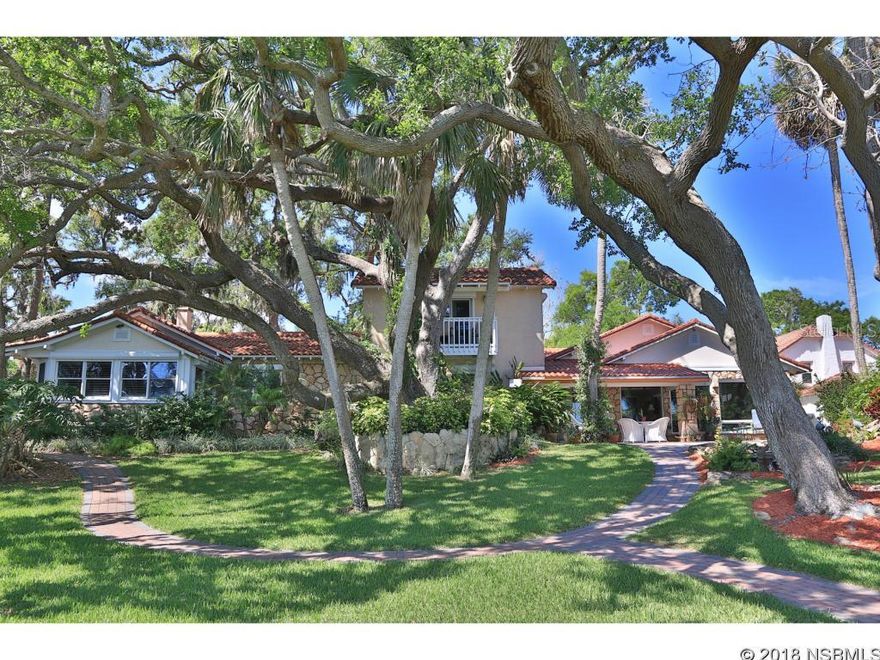 The most unique waterfront estate in New Smyrna Beach.   Approximately one acre of beautifully  landscaped property with 150 ft of waterfront.  A secluded lagoon setting 5 minutes by boat to the intracoastal.  A natural playground for manatees and dolphins.  Two Koi ponds with waterfalls.  200 year old Live Oak trees add drama to the front and back of home.  Entire property walled for total privacy and security.    This is a one of a kind water front property with high elevation .   Flood insurance is not required. ;Water: City