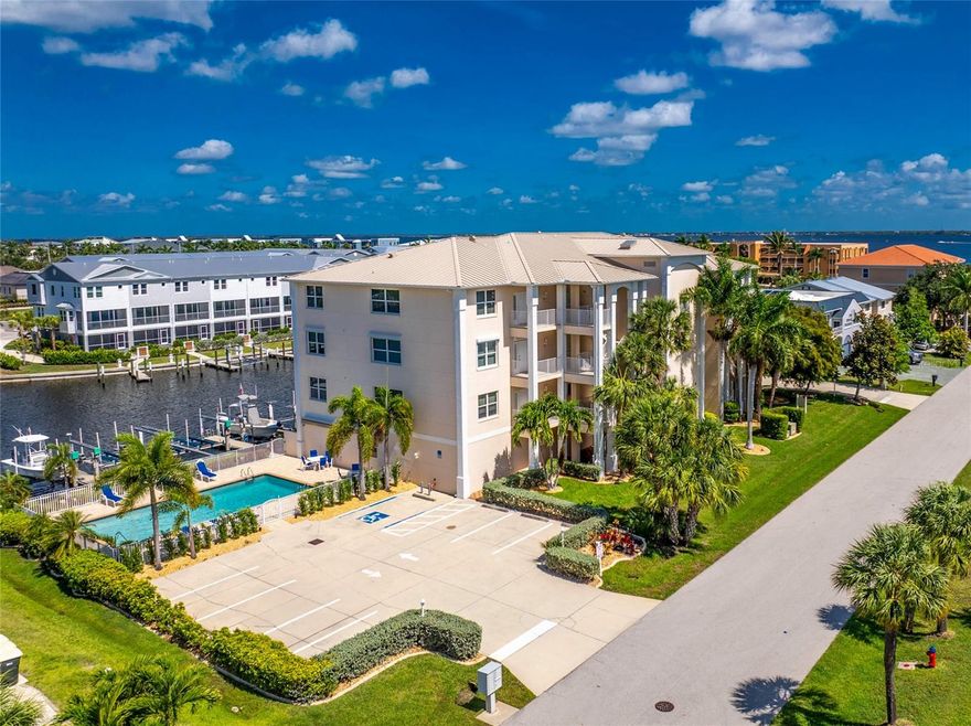 Stunning LUXURY WATERFRONT Turn-Key Condo with DEEDED DOCK/BOAT LIFT in Captain’s Landing – Your Paradise Awaits! Discover coastal living at its finest in this beautiful over 2,000 sq ft waterfront condo in highly sought-after Captain’s Landing, Punta Gorda Isles (PGI). This upgraded 2-bedroom, 2-bath residence also has a versatile den that functions perfectly as a third bedroom or flex space, plus direct, quick boating access to Charlotte Harbor and beyond. Boaters and fishermen, this is your dream come true! Step inside and be greeted by an abundance of natural light pouring through oversized windows and sliding glass doors. The open, flowing floor plan features a gourmet eat-in kitchen with solid wood surfaces, decorative display areas, and a full suite of appliances including newer refrigerator. A formal dining room and bright living space complete the area, perfect for entertaining. Both bedrooms boast generous walk-in closets, while the luxurious master bath impresses with a large glass block shower and dual sinks. Elegant decorative window treatments complete the picture of refined coastal living. Recent updates include a new hot water heater (2026), new roof on the building (2018), and a washer and dryer approximately four years old that have been rarely used. Relax on your private screened-in lanai and soak in breathtaking sunset views over the water. Your deeded dock is just steps away, complete with a new 10,000 lb boat lift, new fish cleaning station, water, and electric hookups—ideal for fishing, cruising, or simply enjoying life on the canal basin. This fully furnished, turn-key condo is move-in ready and includes deeded underground parking space #9 plus a dedicated storage unit. Community amenities feature a heated pool and the ultimate in convenience with covered parking. Located just minutes from Fishermen’s Village, Gilchrist Park, and historic downtown Punta Gorda, you’ll enjoy world-class dining, shopping, boating events, and waterfront festivals right at your doorstep. Don’t miss this rare opportunity to own a truly upgraded, waterfront gem in one of Southwest Florida’s most desirable boating communities. Schedule your showing today and start living the Florida lifestyle you’ve always imagined!