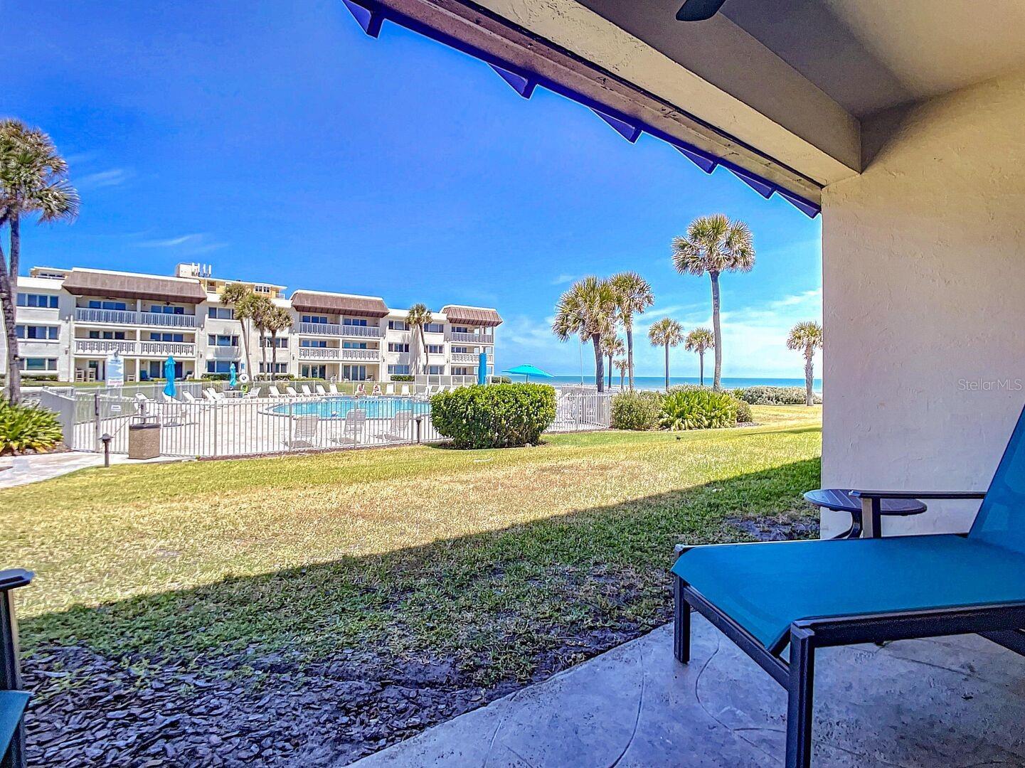 Embrace idyllic Florida living at Chateau by the Sea's Unit 14A. This thoughtfully designed 2-bedroom, 2-bathroom condo offers a perfect haven for families or friends. Wake up to sunrises peeking over the Atlantic from your patio. The salty breeze is a delightful way to start the day. Dive into the refreshing pool or stroll to the beach for sandcastle building and relaxation. The condo boasts a well-equipped kitchen for preparing meals at your leisure. Unwind with complimentary Wi-Fi and cable TV after exploring the nearby shops, restaurants, and activities. Unit 14A's prime location places you in the heart of New Smyrna Beach to experience all the charm this vibrant beach town offers.