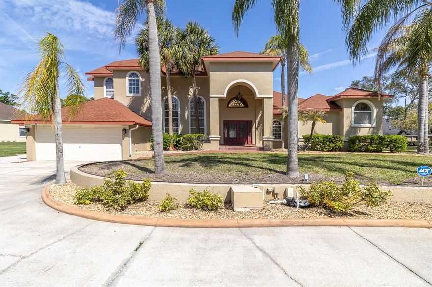 One or more photo(s) has been virtually staged. One or more photos  have been virtually staged 4404 Lake in the Woods which features 4 Bedrooms 3.5 Bathroom
Garage: 3-car Living Space of 5,410 sq. ft.
The home has undergone significant enhancements to ensure a contemporary living experience with a new roof in 2023 enhancing the home's structural integrity and aesthetic appeal. Upgraded Air Conditioning (2022 & 2018): the home maintains a comfortable environment year-round. The home's interior is thoughtfully designed for both luxury and functionality. With a grand entrance double leaded glass front doors open to a spacious living area with soaring ceilings and a dazzling crystal chandelier, craved marble gas fireplace setting the tone for the home's elegance. The gourmet kitchen is equipped with high-end appliances, ample counter space, and a layout that caters to both casual meals and formal entertaining along with a second fireplace, a wood bar with wine cellar, and views of the pool.  The primary bedroom is on the first floor along with the primary bathroom fit for a king or queen with a towel warmer, stand-up showing, sauna tub, and a second washer and dryer hookup for the convenience of the owner. 
The beautiful wood staircase that will take you to the 23 ft. x 23 ft. loft area serves as a flexible space for a billiard room, play area, or additional living quarters.
The outdoor spaces are designed to maximize the enjoyment of Florida's beautiful climate. Let’s not forget the outdoor shower and bedroom and bathroom for your guess. 
Expansive Pool Area The 30 ft. x 63 ft. pool deck offers ample space for sunbathing, socializing, and enjoying the picturesque lake views. The pool also has a new pool enclosure in 2024
The outdoor kitchen includes a built-in Thermador grill and a beer refrigerator, making outdoor cooking and entertaining a delight. 
Lush Landscaping 0.74-acre lot features palm trees, rock beds, a water fountain in the front yard with Curb-A-Lawn edging, irrigation well, creating a verdant and inviting outdoor space. 
Lake in the Woods is renowned for its serene environment and exceptional amenities:
 The community offers 24/7 staffed, gated access, ensuring a secure and private living environment. Residents can enjoy tennis courts, a pickleball court, a dog park, fishing on the lake, an island pavilion, and scenic walking trails. 
 
Convenient Location situated near the Gulf of Mexico, local businesses, hospitals, and major highways, Lake in the Woods provides both tranquility and accessibility.