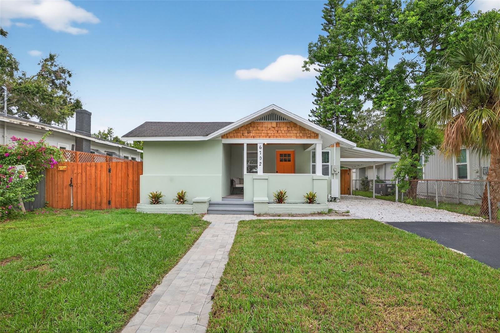 Welcome to 6702 N Branch Ave – a RARE POOL home in the heart of Seminole Heights!
This fully remodeled 3-bedroom, 2-bathroom home is the perfect blend of modern luxury and historic neighborhood charm. Tucked into one of Tampa’s most desirable communities, this home offers not only a beautiful living space but also the lifestyle Seminole Heights is known for—tree-lined streets, historic bungalows, trendy restaurants, local breweries, and a strong sense of community, all just minutes from downtown Tampa, ZooTampa at Lowry Park, and major highways.
From the moment you arrive, you’ll notice the charm and attention to detail. The home features a welcoming covered front porch, fresh exterior paint, and a brand-new asphalt driveway, all framed by a fully fenced yard. Step inside to discover a bright, open floor plan filled with natural light, luxury vinyl plank flooring, fresh interior paint, and elegant designer touches throughout.
The spacious living room is designed for both relaxation and entertaining, seamlessly flowing into the kitchen for an open-concept feel. At its center, a built-in modern electric fireplace serves as a stylish focal point, adding warmth and sophistication to the space.
The chef-inspired kitchen is the true showpiece. It features all-new white shaker cabinetry with modern gold hardware, built-in shelving, a spacious pantry, stainless steel appliances, and a large island with extra storage and breakfast bar seating. Quartz countertops with a marble look and a custom tile backsplash elevate the space, making it as functional as it is beautiful. Whether cooking for family or entertaining guests, this kitchen was designed to impress.
The primary suite is a luxurious retreat. The bedroom is spacious enough for a king-sized setup and additional furniture, while the ensuite bathroom steals the show. Here you’ll find a double vanity with elegant gold accents, plus a huge walk-in double shower with dual shower heads and two detachable handheld sprayers. The shower is wrapped in high-end marble-look porcelain tile, giving it a true spa-like feel. The second bathroom has also been fully renovated with coordinating finishes, including a stylish vanity, a tub/shower combo, and gold hardware.
Step outside to your private backyard oasis. Homes with pools are hard to come by in Seminole Heights, and this one is ready for endless Florida summers. Relax by the large in-ground pool, entertain friends under the covered outdoor kitchen gazebo, or enjoy the privacy of your fully fenced yard. The backyard is designed for both everyday enjoyment and hosting unforgettable gatherings.
Seminole Heights is one of Tampa’s most historic and vibrant neighborhoods. Known for its early 20th-century bungalows, local coffee shops, craft breweries, and top-rated dining, the area has experienced an exciting revitalization while still keeping its charming, community-focused feel. Living here means you’ll be close to it all—whether it’s weekend brunch, local markets, cultural attractions, or a quick trip to downtown Tampa.
This home is completely move-in ready and offers the rare combination of modern updates, a pool, and an unbeatable location. If you’ve been searching for a stylish, fully remodeled home in one of Tampa’s hottest neighborhoods, look no further—this is the one.
Don’t miss your chance to own a Seminole Heights POOL Home that checks every box!