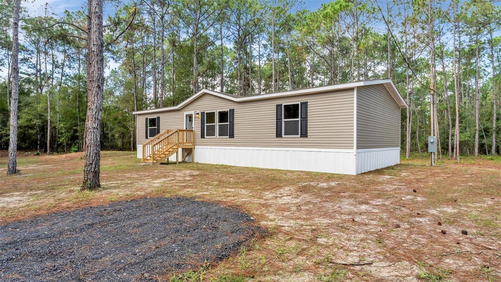 Photo of 14960 Commonwealth Avenue N, Polk City, FL 33868 (MLS # L4966109)