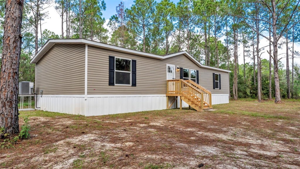Photo of 14960 Commonwealth Avenue N, Polk City, FL 33868 (MLS # L4966109)