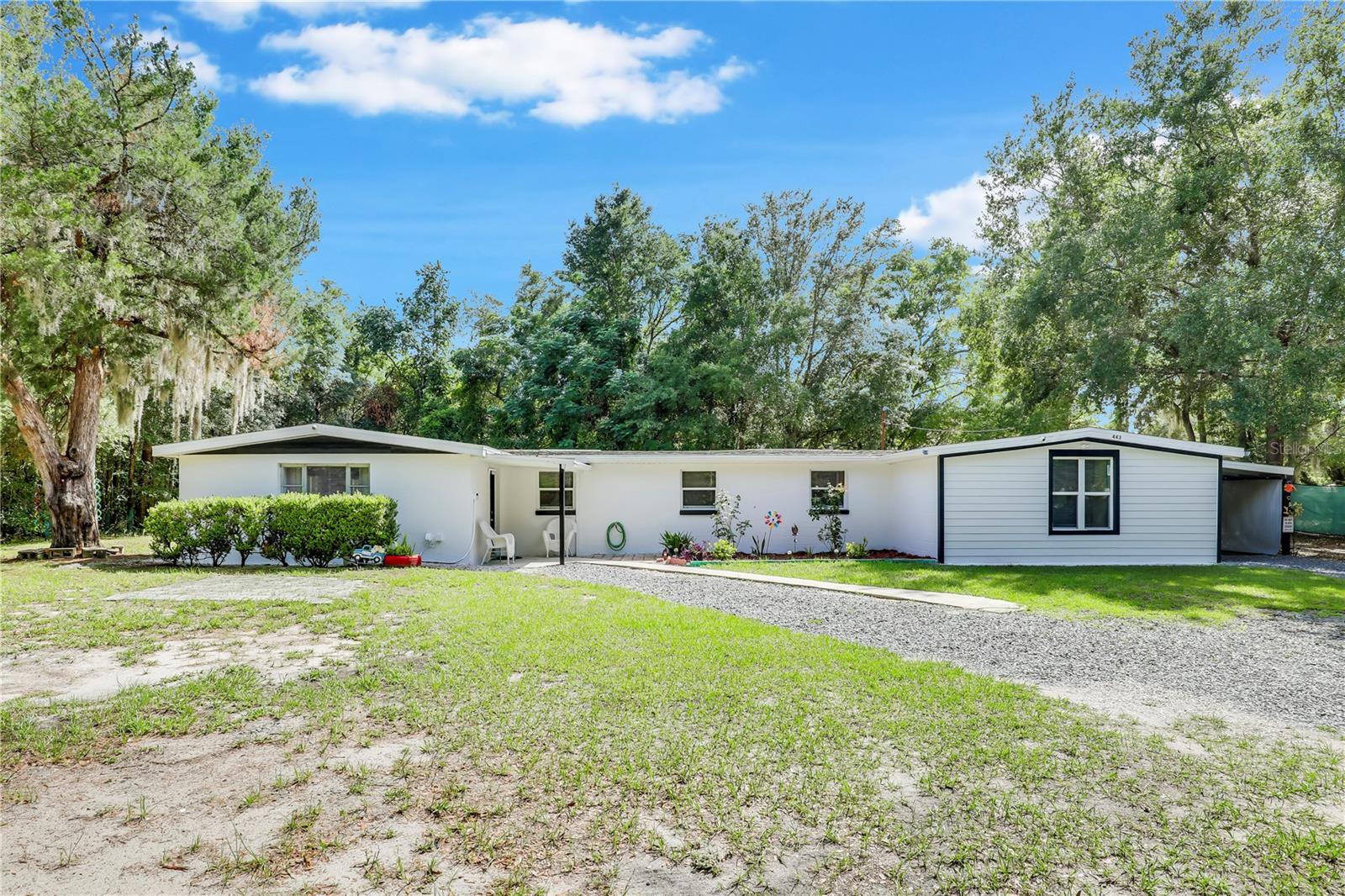**HUGE LOT**COMPLETELY REMODELED**POTENTIAL INCOME PRODUCING** Welcome home to this VERSATILE and SPACIOUS property, remodeled from top to bottom! This home sits on a HUGE FENCED-IN LOT with a GATED DRIVEWAY, ensuring PRIVACY and SECURITY. This house features 4 beds/3 baths, each with floor-to-ceiling tile in the shower/tub and LARGE WALK-IN CLOSETS. Inside, an OPEN LAYOUT creates a bright and welcoming atmosphere. The kitchen boasts gorgeous cabinetry and countertops. A dedicated laundry room with BUILT-IN SHELVES adds convenience. PLUS, discover a separate GUEST SUITE complete with its own bathroom, a huge walk-in closet, and a private entrance – perfect for MULTIGENERATIONAL living, or an INCOME-PRODUCING AIRBNB. Outside, you'll find a PAVERED PATIO, an ATTACHED CARPORT, and a HUGE DRIVEWAY with abundant parking – including HOOKUPS AND SPACE FOR AN RV. Enjoy a peaceful, country feel while being just minutes from Blanding Blvd and tons of shopping and dining. This home truly is an amazing opportunity, don’t miss out!