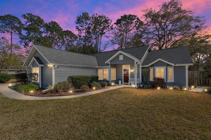 Welcome to this well maintained 3-bedroom, 2-bath home offering 1,964 sq ft of comfortable living in the sought-after CherryTree neighborhood,  in the heart of NW Gainesville. Step through the front door into an inviting living room anchored by a double-sided fireplace. To the left, the open-concept kitchen with stainless steel appliances, a spacious walk-in pantry and plenty of counter area for bar stools, perfect for casual entertaining. An eat-in area rounds out the space, enjoy morning coffee with views through the front windows. The dining room opens into a generous great room/sunroom,  a versatile bonus space that adapts to your lifestyle as a second living room, playroom or home office. Two bedrooms share a hall bathroom on one side of the home. On the opposite side the primary suite with fully remodeled primary bathroom showcases porcelain tile, an oversized walk-in shower with dual shower heads, double sinks and two walk-in closets.  Throughout the main living areas, laminate floors and tile add warmth and easy maintenance. Upgrades include high-efficiency double-pane windows and a new roof (2025). Additional highlights include HVAC (2019), re-plumbing (2019), gutters, irrigation and an ADT Security System. Step outside to your fully fenced backyard with a paver patio and landscaping. A small side shed adds handy storage, while the two-car garage houses the stackable washer and dryer. Ideally located with schools nearby, a short walk or bike ride to Norton Elementary, direct bus service to Shands/UF, and quick access to Santa Fe College and I-75.