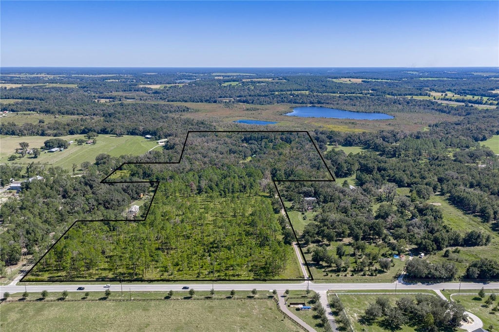 Photo of 18728 Lake Iola Road, Dade City, FL 33523 (MLS # TB8561778)