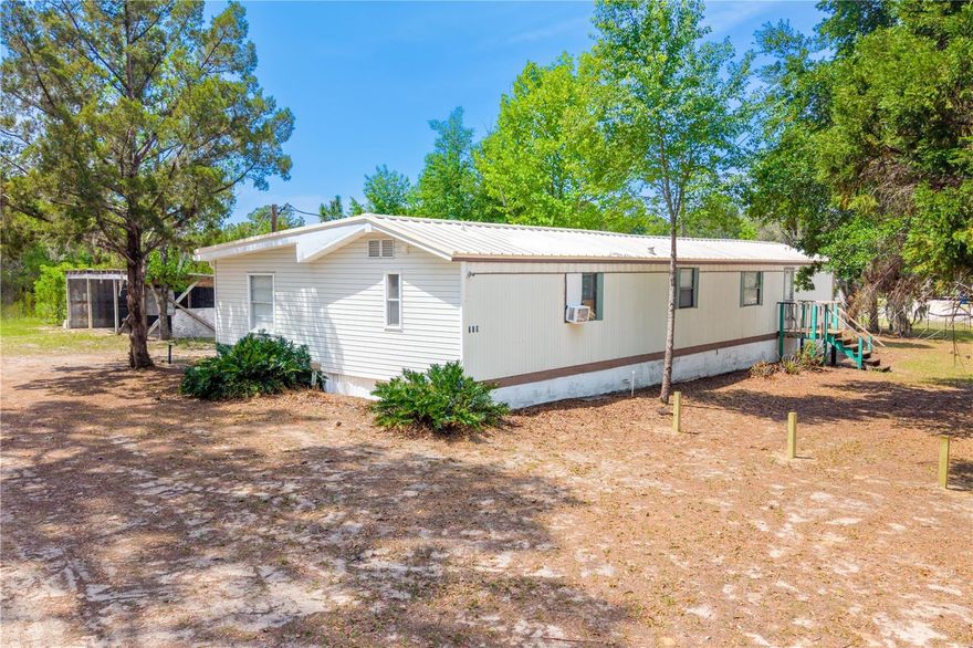 This 3 bedroom, 2 bathroom second set-up mobile home with a permitted addition sits on just over 2 acres and offers plenty of space both inside and out. Metal roof and septic tank new in 2023 adds peace of mind for future owners. The home previously had central heat and air, and while newer flooring was installed, the vents were left in place for easy future reconnection if desired.

Outside, the property features a pole barn located just behind the home, providing great space for storage, equipment, or hobbies. Zoned agricultural, this property offers flexibility for a variety of uses. Conveniently located with easy access to Palatka, Keystone Heights, and Gainesville, you’ll enjoy a more private setting without being too far from town.