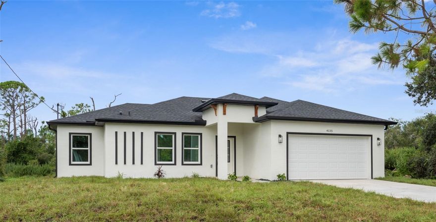 One or more photos have been virtually staged* Stunning brand-new construction **BUILDER WILL CONTRIBUTE TO BUYER CLOSING COSTS!** Check out this modern design meets effortless style. Just-completed 4 bedroom, 2 bathroom home offers a clean, contemporary layout with tile flooring throughout and thoughtfully selected high-end finishes. The gourmet kitchen features stainless steel appliances, a spacious eat-at island, and sleek cabinetry – perfect for both everyday living and entertaining. Bathrooms are fully upgraded with designer touches, including anti-fog mirrors and modern fixtures. Enjoy peace of mind with hurricane impact windows and doors, plus the added durability of a 2-car garage with epoxy flooring. The entryway sets the tone with rock detail, while the home’s location outside of any flood zone makes it as practical as it is beautiful. A true turnkey home, blending quality, style, and security.