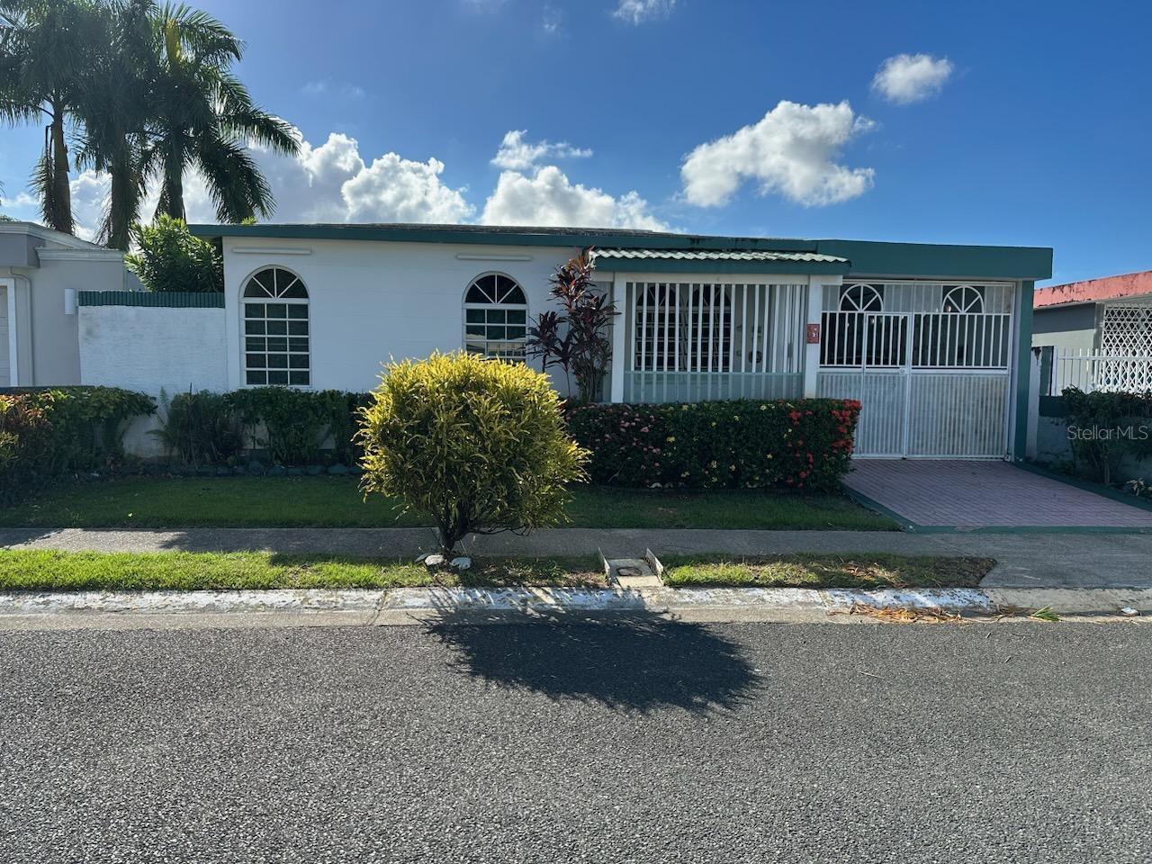 One story family home has 4 bedrooms, 2 bathrooms, spacious livingroom, kitchen, extended carport, balcony, patio with terrace.