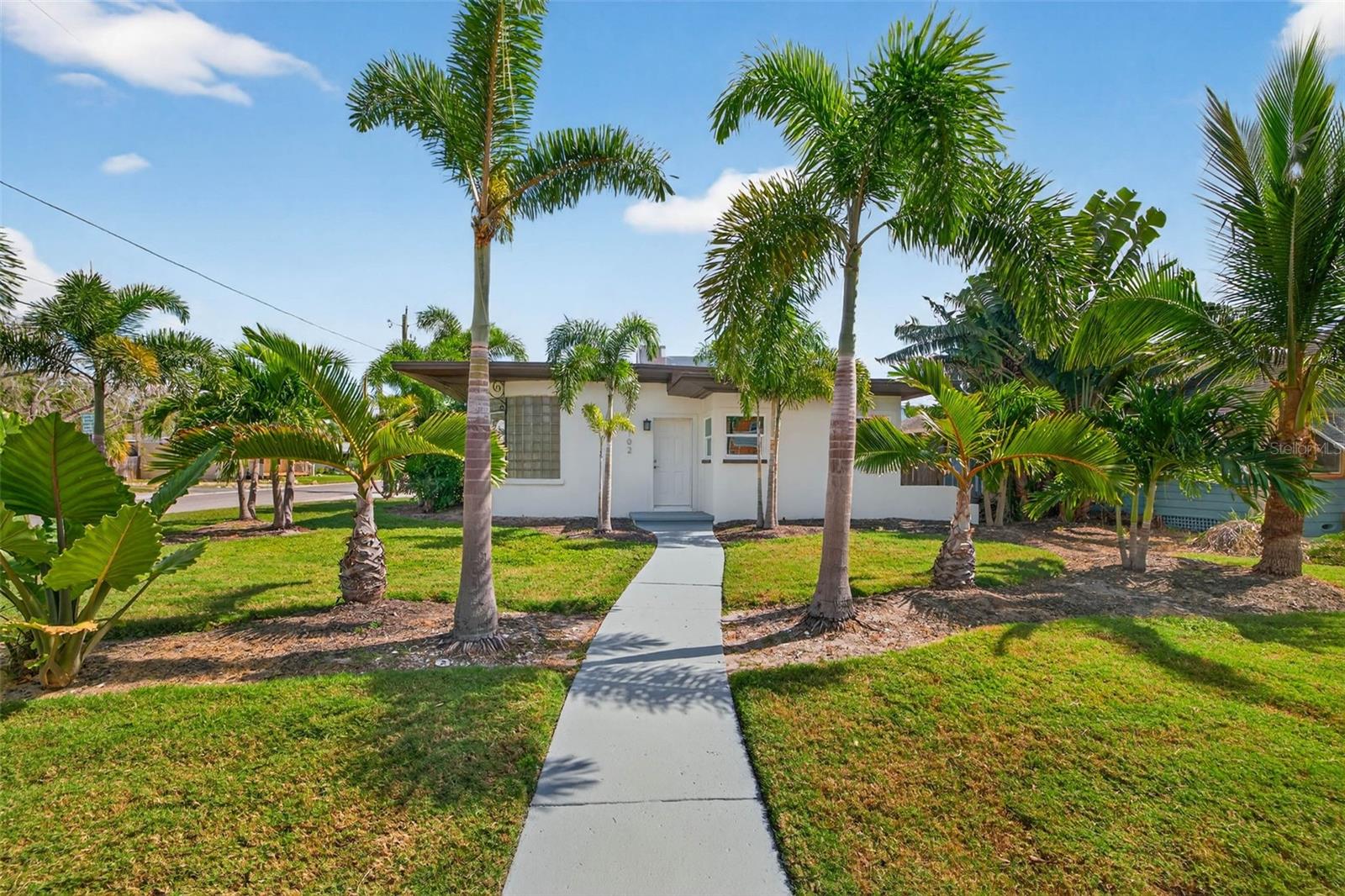 Live the Gulfport lifestyle in this bright and breezy 2-bedroom, 1-bath home with a flex space—perfect for a home office, art studio, or guest room. Sitting on a corner lot and just under 1,300 sq. ft., this home offers plenty of room to relax and enjoy the laid-back Florida vibe.
You’ll love the tile floors throughout, new windows, and brand-new Samsung appliances in the kitchen. Natural light fills every room, giving the space a fresh, airy feel.
Outside, unwind on the back patio surrounded by mature tropical landscaping, or rinse off after a beach day in your outdoor shower. The 2-car garage provides lots of storage for your bikes, beach gear, or weekend projects.
All this just minutes from Gulfport’s waterfront district, with its local restaurants, shops, and weekly markets. Come see why everyone loves calling Gulfport home!