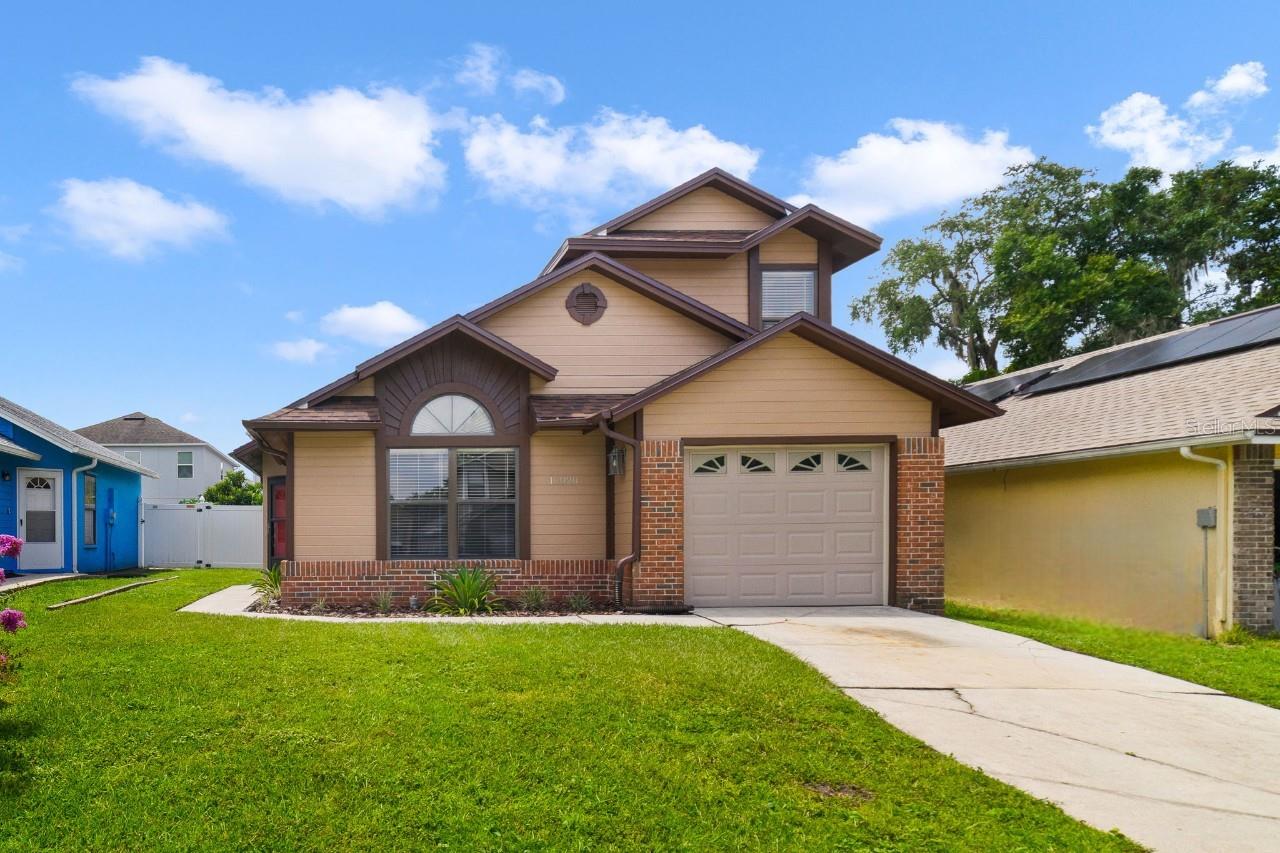 One or more photo(s) has been virtually staged. Seller may consider buyer concessions if made in an offer ~ This move-in ready home in East Orlando’s Creek Water community comes with big ticket items already taken care of – a BRAND NEW ROOF (2025) and A/C (2025)! Set on a quiet CUL-DE-SAC STREET, it is a smart option for first time home buyers or investors looking for a home with NO HOA and a convenient location. The layout features a MAIN FLOOR PRIMARY SUITE complete with a VAULTED CEILING, WALK-IN CLOSET, and a private en-suite bath, offering both comfort and privacy on the first level. The OPEN LIVING & DINING AREAS are filled with natural light thanks to high ceilings and large windows, creating a bright and welcoming space. The kitchen is equipped with desirable STAINLESS STEEL APPLIANCES and delivers a functional layout for everyday cooking and hosting. A main floor half bath adds extra convenience. Upstairs you will find two additional bedrooms and a second full bath providing plenty of space for family, guests, or a home office setup. Outside, a spacious VINYL FENCED yard awaits with an open air patio ideal for weekend cookouts with family or entertaining friends – relax or play! Zoned for A-Rated Cypress Springs Elementary and close to everything; SR 417, Lee Vista, Lake Nona, Waterford Lakes and Avalon Park – this home puts you near a variety of shopping, dining and recreation options. With a nicely laid out floor plan, key upgrades, and a central location in a well established East Orlando neighborhood, this home is ready for its next chapter. Call today to schedule a tour!