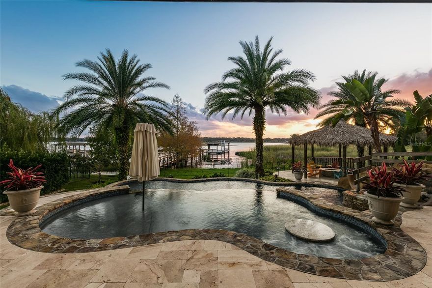 Resort style living on beautiful Sylvan Lake. Ideally positioned along the lake's northern shore, this exceptional estate rests on 1.3 acres of manicured grounds behind its own private gates.