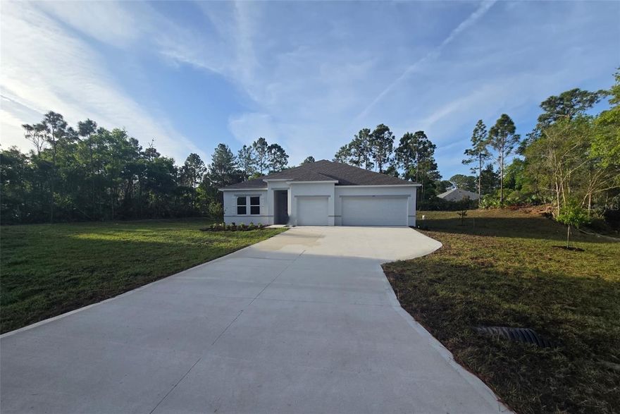 Ready Now!! Claim your piece of paradise!  An exceptionally oversized homesite sets the stage for endless possibilities, with ample room for a boat, RV, and more, all while enjoying the coastal charm of Edgewater. Known as the locals’ choice for East Coast beaches, this waterfront community rests along the tranquil Indian River in Florida and is celebrated for its relaxed atmosphere, scenic parks, nature trails, and proximity to some of the region’s most beautiful shorelines. Local boutiques, waterfront dining, and year-round community events create a vibrant setting surrounded by natural beauty.

The Wilmington plan showcases impressive design and thoughtful upgrades throughout. A striking 8 foot front door opens to soaring 9 foot 4 inch ceilings, enhanced by deluxe trim and cordless blinds that elevate every space. The great room flows effortlessly into a gourmet kitchen featuring the builder’s upgraded configuration with wall oven and cooktop, abundant cabinetry, and generous workspace designed for both everyday living and memorable gatherings.

Privacy and comfort are beautifully balanced with a split bedroom layout. The primary suite becomes a peaceful retreat with upgraded cabinetry, enhanced countertops, dual split vanities, and an oversized tile shower as part of the deluxe bath option. On the opposite side of the home, two additional bedrooms are thoughtfully positioned alongside a full bath and a convenient linen closet, creating a well organized and functional private wing. The fourth bedroom features its own private bath, adding another level of comfort and flexibility.

Outdoor living is just as impressive, beginning with the welcoming covered front porch and continuing to the oversized screened patio that extends the living space into the outdoors. Hurricane shutters provide added peace of mind, while professional landscaping and irrigation complete the exterior with lasting beauty.

An oversized three car garage delivers outstanding space for storage, hobbies, and vehicles. Every detail of this Wilmington plan reflects quality construction, elevated finishes, and the added confidence of a full builder warranty, all set within one of the most desirable coastal locations on Florida’s East Coast.