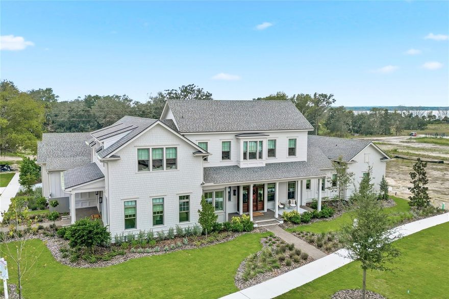 Stunning J&J Model Home in Briley Farm – Leaseback Opportunity! Step into unmatched luxury at this impeccably crafted J&J Building model home, perfectly positioned on a premier corner lot in the sought-after Briley Farm community of Oakland, FL. Designed with exceptional attention to detail, this residence offers 4 bedrooms, 4 full baths, 2 powder baths, a loft, bonus room, private office, two laundry rooms, and a detached casita with a full ensuite—ideal for guests, in-laws, or extended stays. Inside, the home showcases elevated finishes at every turn, including Sierra Pacific windows—62 in total—filling the home with natural light, an impressive Euro-style 9'+ bifold slider, and a stunning gas fireplace anchoring the main living space. The chef’s kitchen boasts Wolf and Sub-Zero appliances, exquisite Quartzite counters in both the main and back kitchens, and a fully equipped back kitchen designed for effortless entertaining. A custom primary closet with lighted rods adds a boutique touch to everyday living. Outdoor living is equally exceptional. Enjoy a lap pool and hot tub, gas fire pit, and luxurious marble coping and pool decking, all beautifully framed by a $70,000 professionally designed landscaping package and a fully fenced yard for privacy. Additional upgrades include Sonos speakers, security system with cameras, clay tumbled pavers on the porches, and a Generac generator for added comfort and peace of mind. With a 4-car garage, impeccable craftsmanship, and a leaseback opportunity, this home offers the best of luxury and convenience. Furniture is negotiable, allowing you to tailor the space to your vision. Discover refined living in one of Oakland’s most desirable communities—this model home truly sets the standard.