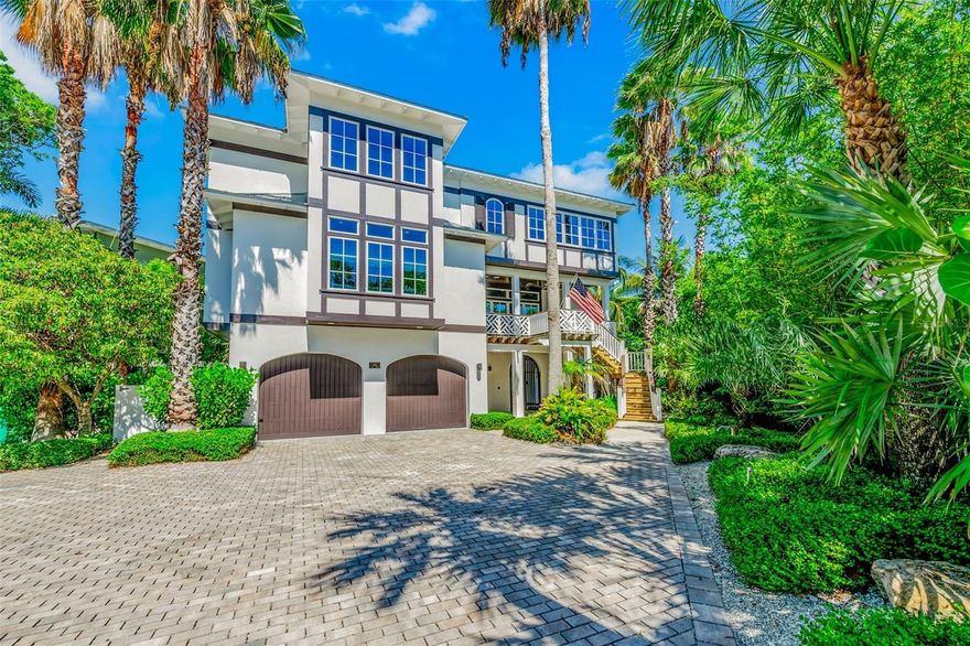 LUXURY COASTAL LIVING AT IT’S FINEST! This one-of-a-kind residence, designed by Emily Anne Smith, stands on one of the most sought-after streets in Anna Maria, just one home from the Gulf and a short walk to the charm of Pine Avenue. The location offers an exceptional combination of beach proximity, walkability, and privacy.
Thoughtfully designed for both entertaining and multi-generational living, the home offers over 4,500 square feet of curated living space with distinct gathering areas throughout. The main living room opens to a front verandah and features a fireplace, with an additional fireplace located in the primary suite.
The kitchen, designed for both function and presentation, featuring marble countertops and backsplash, custom cabinetry, a butler’s pantry, and dual sinks is well-suited for both everyday use and larger gatherings.
Emily Anne Smith is known for her mindful and timeless coastal design, and this home reflects that level of craftsmanship throughout.
The property includes a main residence and a separate cottage, providing flexibility and privacy with a total of 5 bedrooms and 4.5 bathrooms. Additional features include multiple verandahs, two dedicated study spaces, and a well-designed outdoor living area with a pool, shower, and lounge space.
The private guest quarters with separate entrance offers an ideal setup for extended family, guests, or private accommodation.
This is a rare opportunity to own a thoughtfully designed home in a premier Anna Maria location, with Gulf views and exceptional sunset exposure.