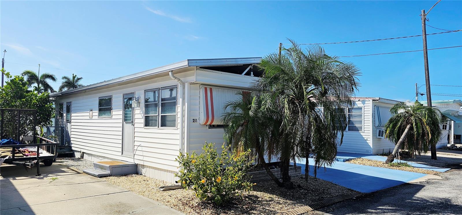 Paradise Bay Estates Renovation Opportunity: 1BR/1BA Mobile Home in +55 co-op community that is located along the shoreline of Sarasota Bay. Park is a short 2 miles to bike, walk, drive or boat to Anna Maria Island. Spectacular location along the Florida Suncoast.
Bring your vision and creativity to this mobile home in the heart of of this vibrant senior community. This charming unit weathered some damage from the 2024 hurricanes and is now the perfect blank canvas for a personalized renovation. Whether you're dreaming of a cozy year-round retreat or a stylish seasonal escape, this home is ready for your personal touch. Paradise Bay Estates offers a rich array of amenities for the active senior lifestyle, including a clubhouse with social events, heated pool and spa, shuffleboard, pickleball leagues, woodshop, community boat ramp, and frequent potlucks and dances. Don’t miss this rare chance to transform a well-located mobile home into your own slice of Florida paradise!
